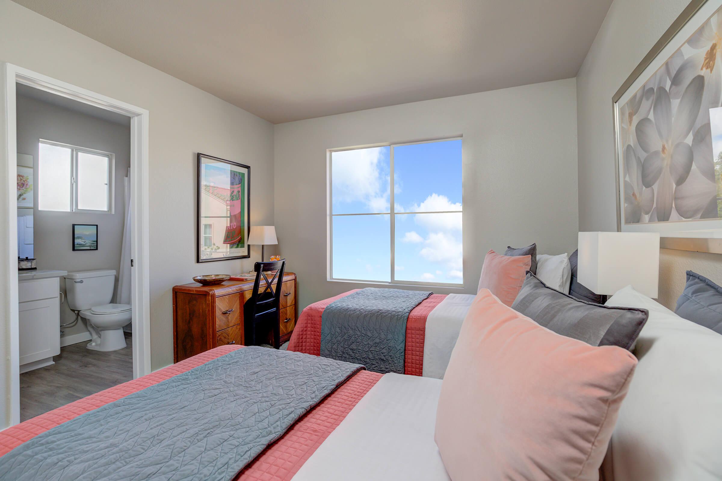 a bedroom with a large bed in a hotel room