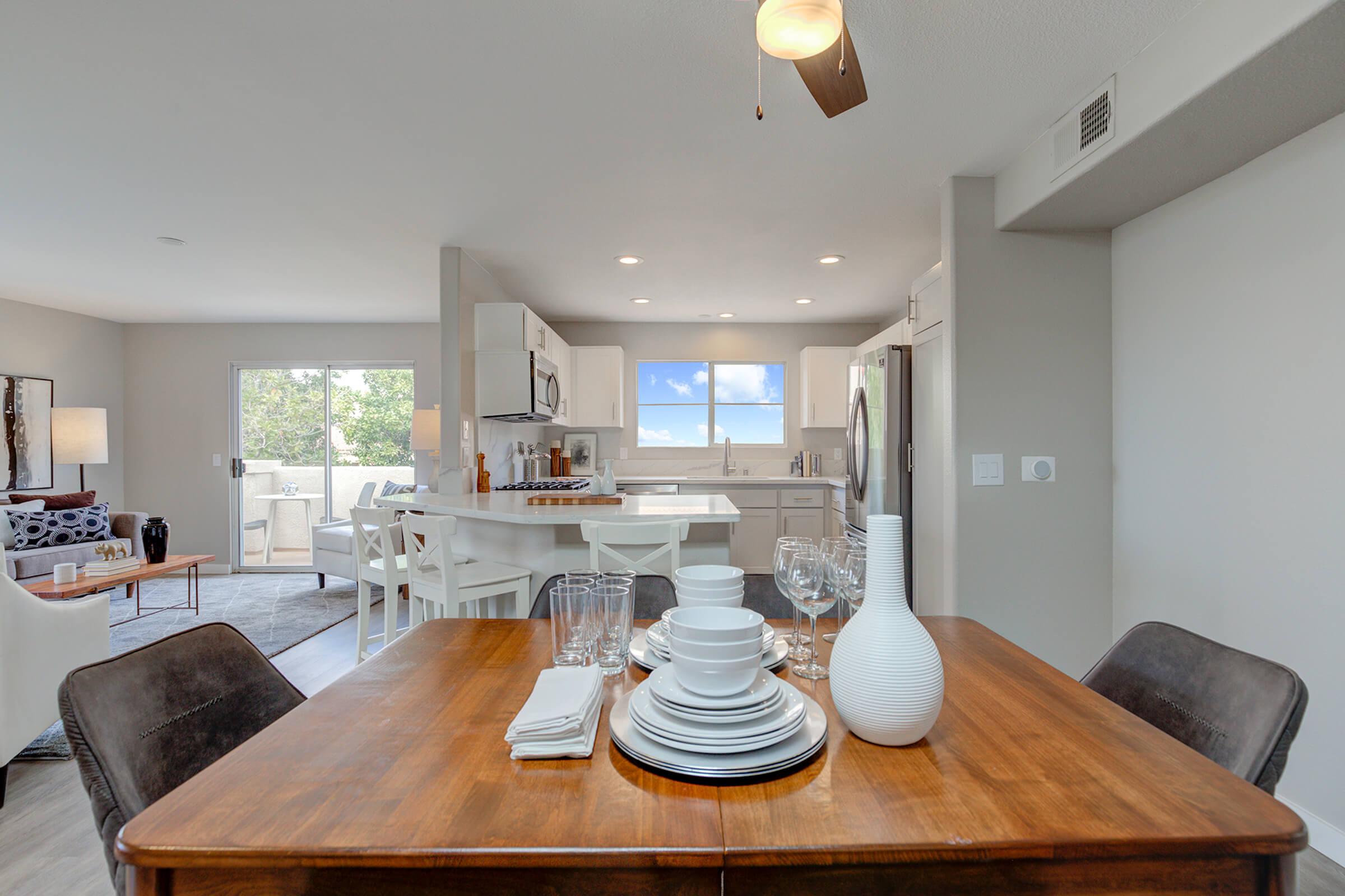 a living room filled with furniture on top of a wooden table