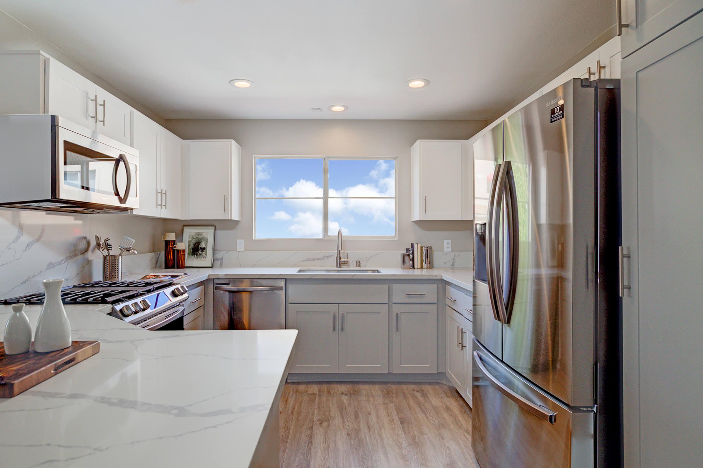 a kitchen with an island in the middle of a room