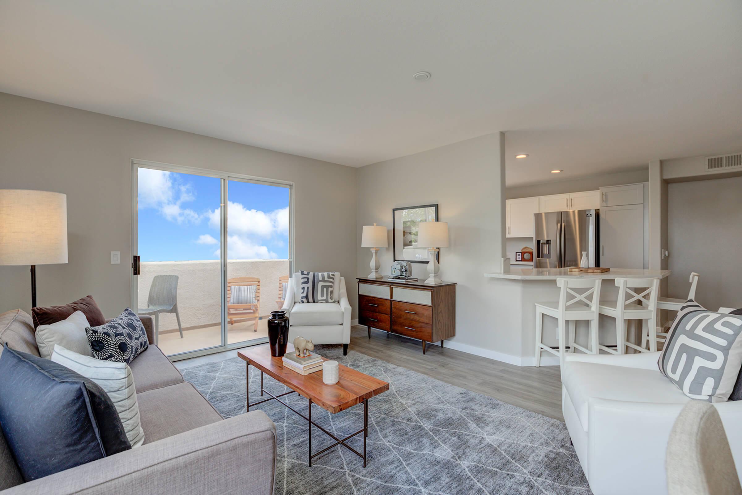 a living room filled with furniture and a flat screen tv