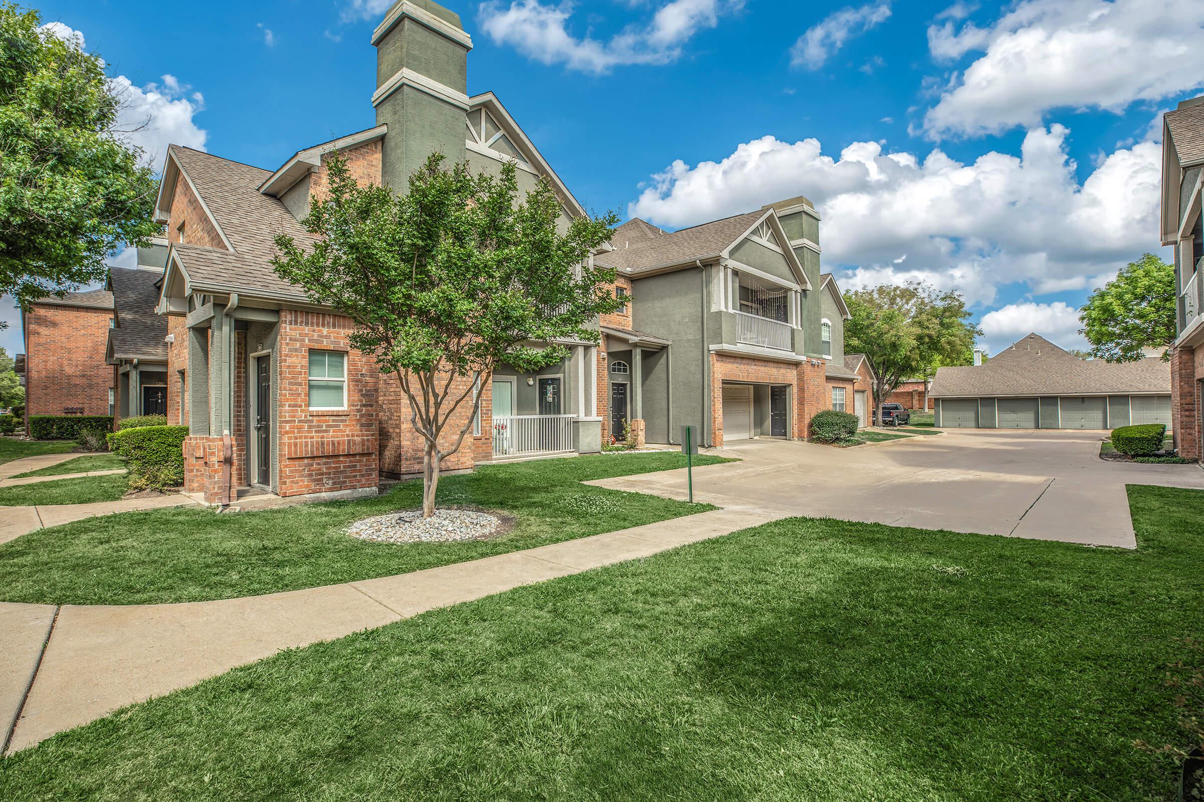 Villages at Clear Springs community buildings with green grass