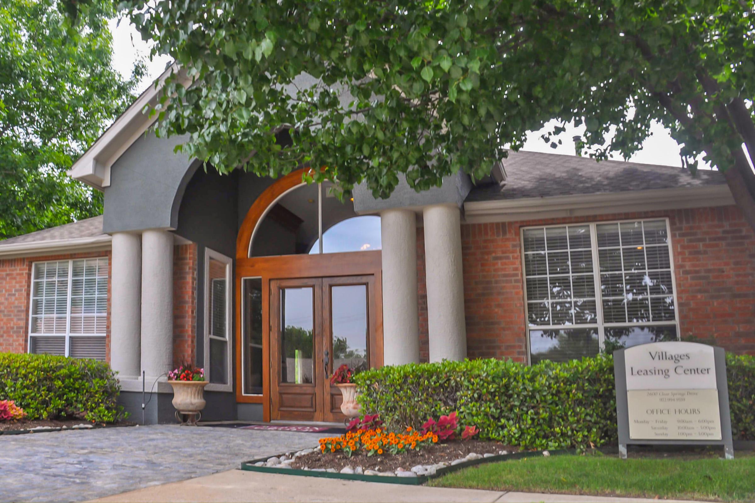 leasing office with green trees