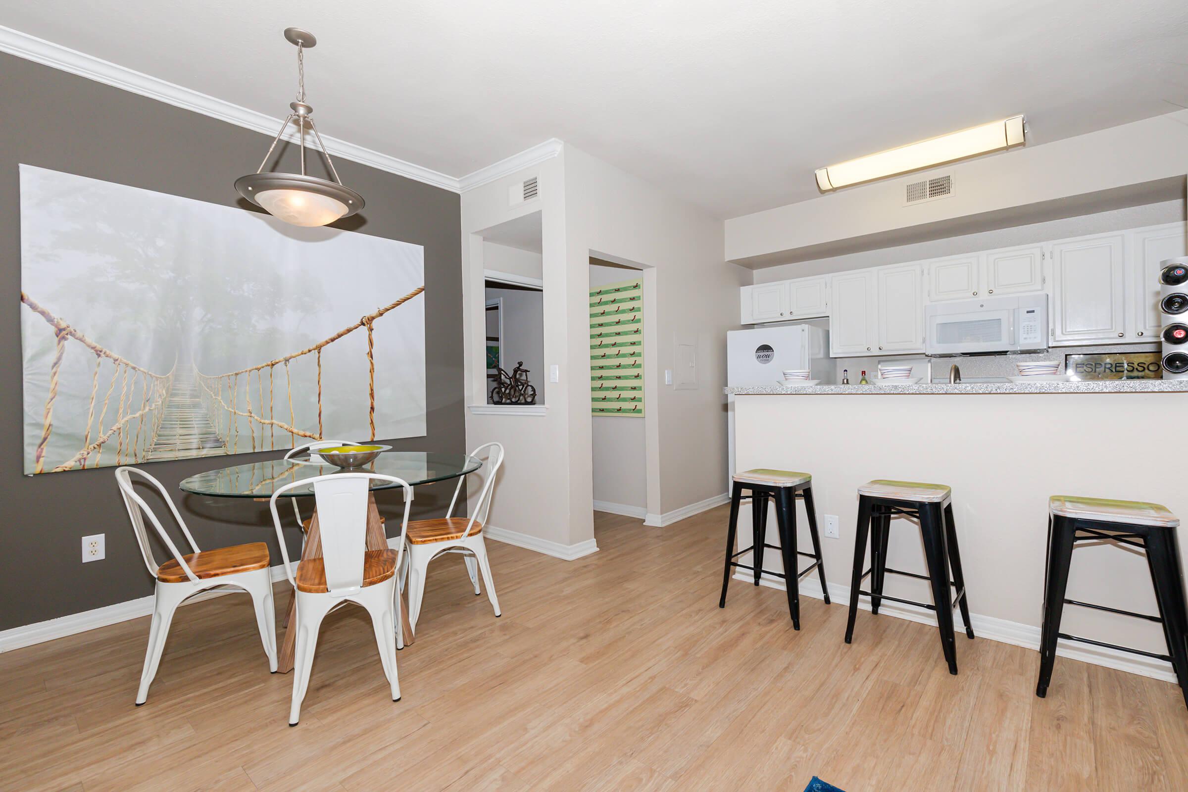 furnished dining room with wooden floors