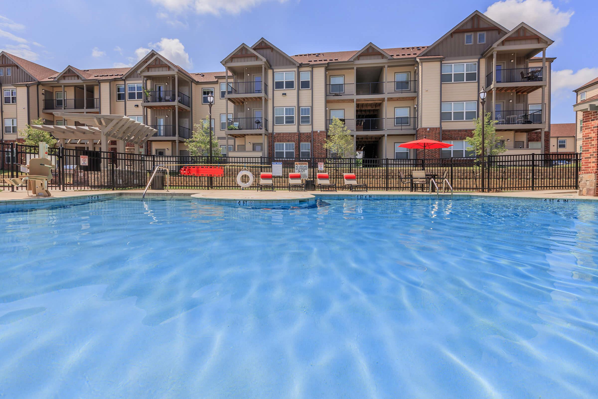 a large pool of water in front of a building