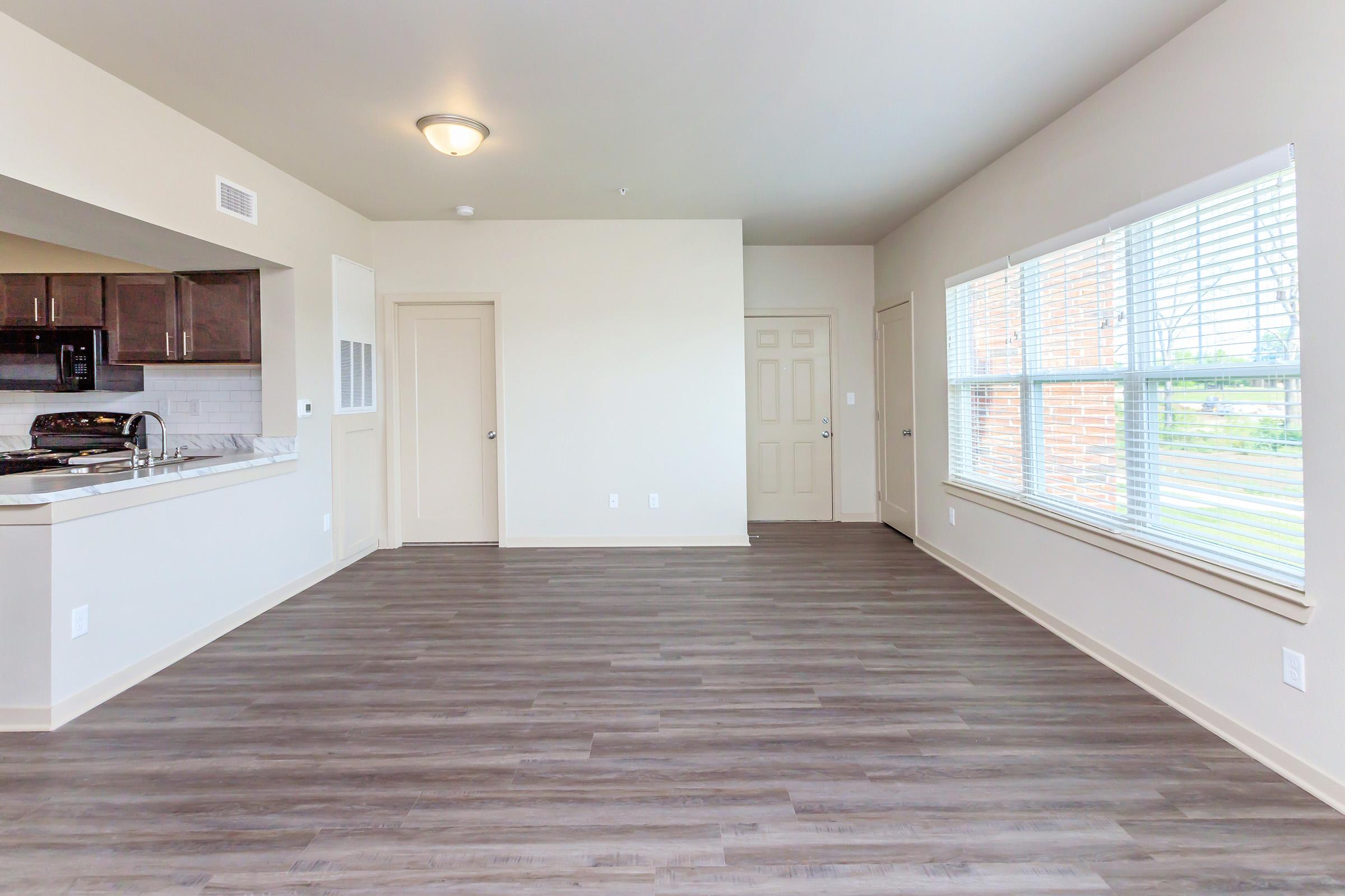 a kitchen with a wood floor