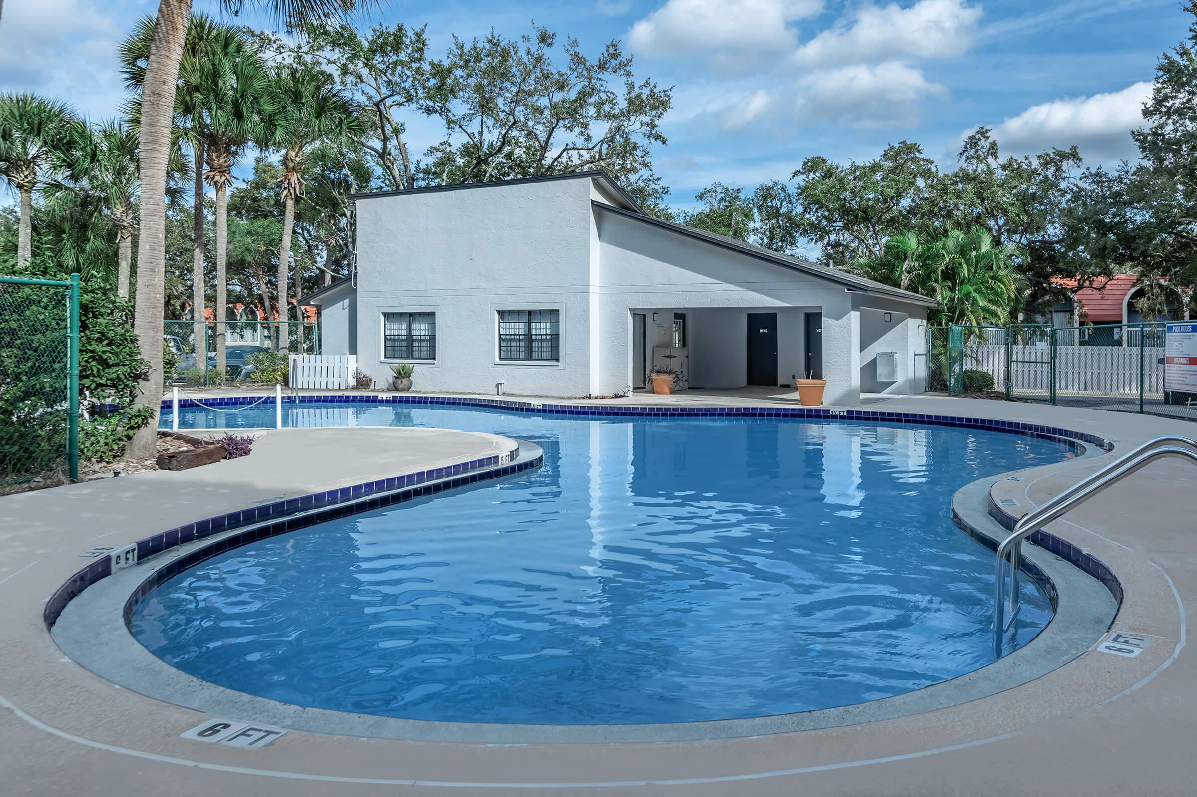 a pool next to a body of water