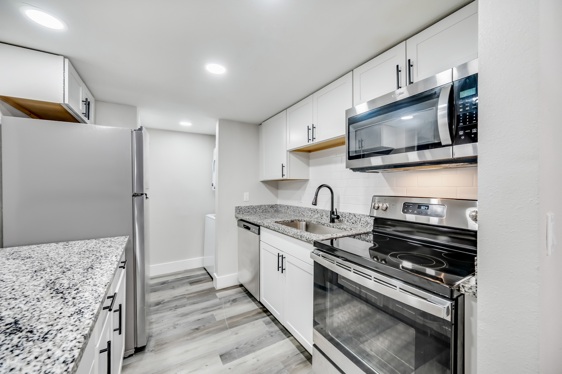 a kitchen with a stove and a sink