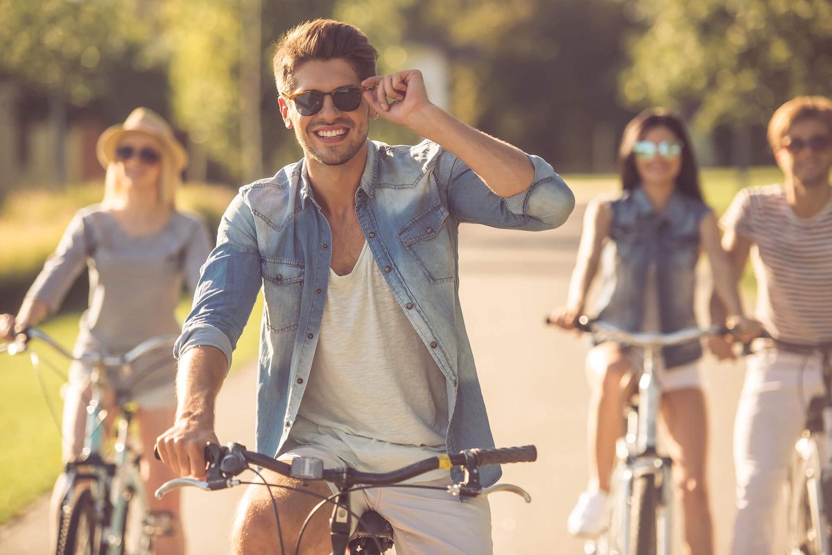 Friends cycling in park iStock-618221008.jpg