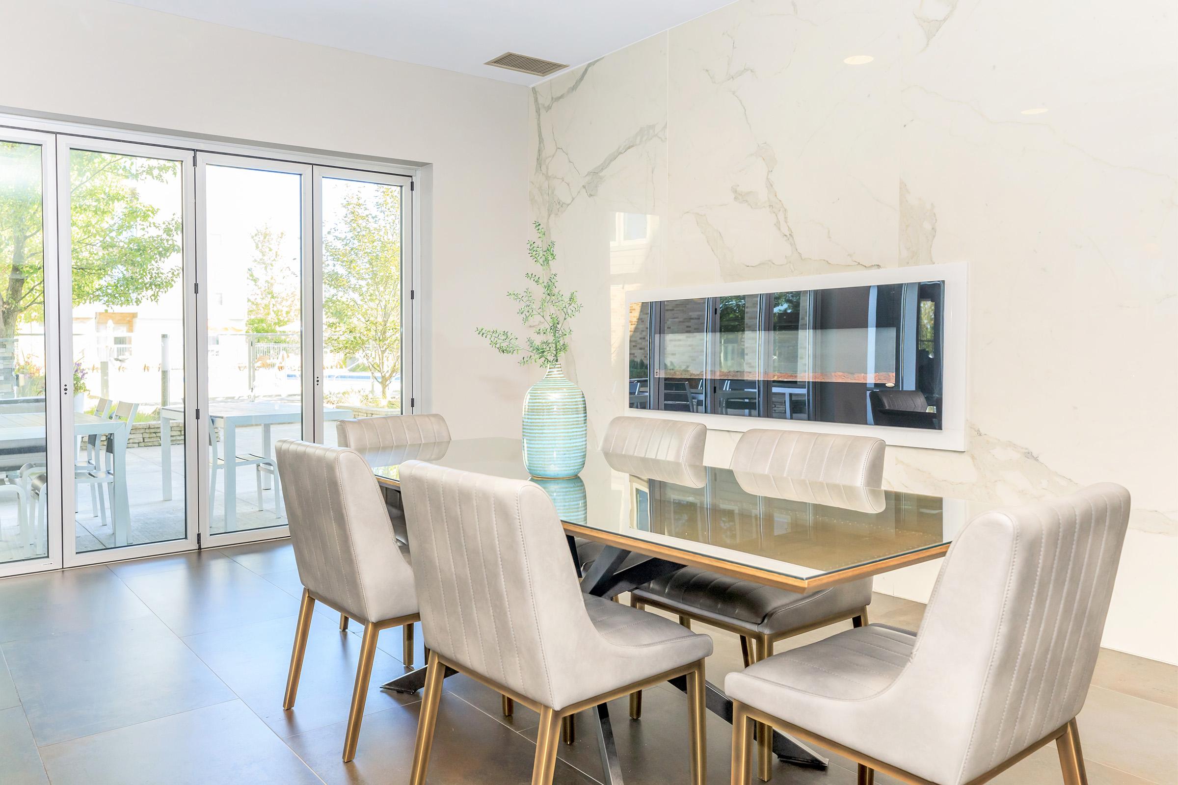 a dining room table in front of a window