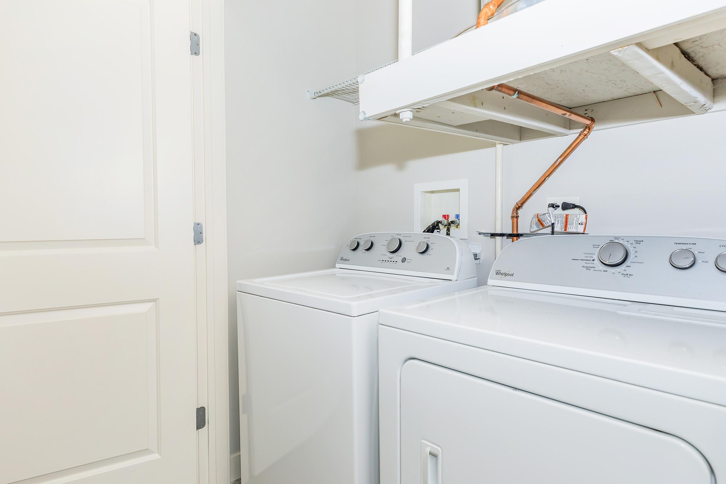 a stove top oven sitting inside of a kitchen