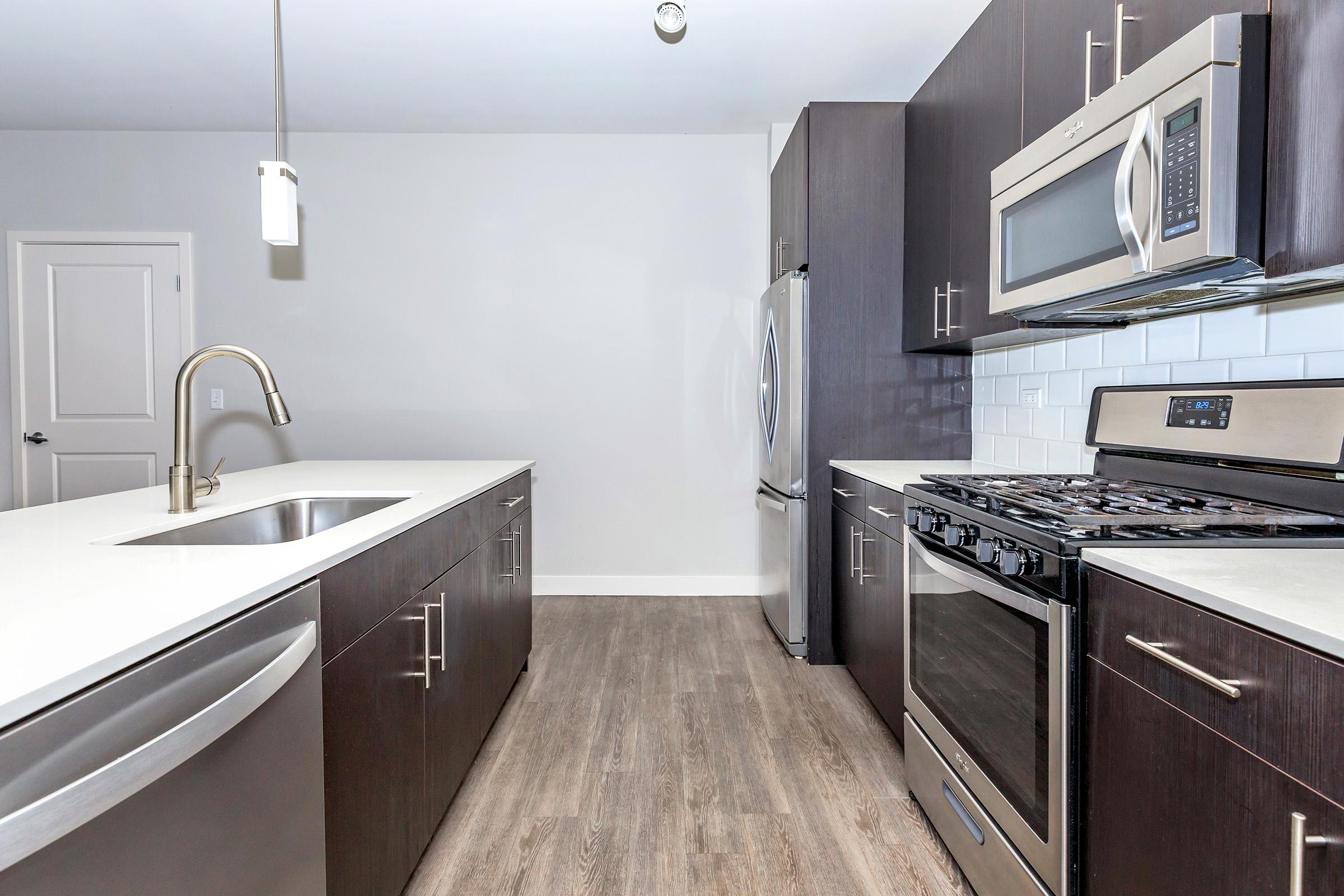 a kitchen with a stove and a sink