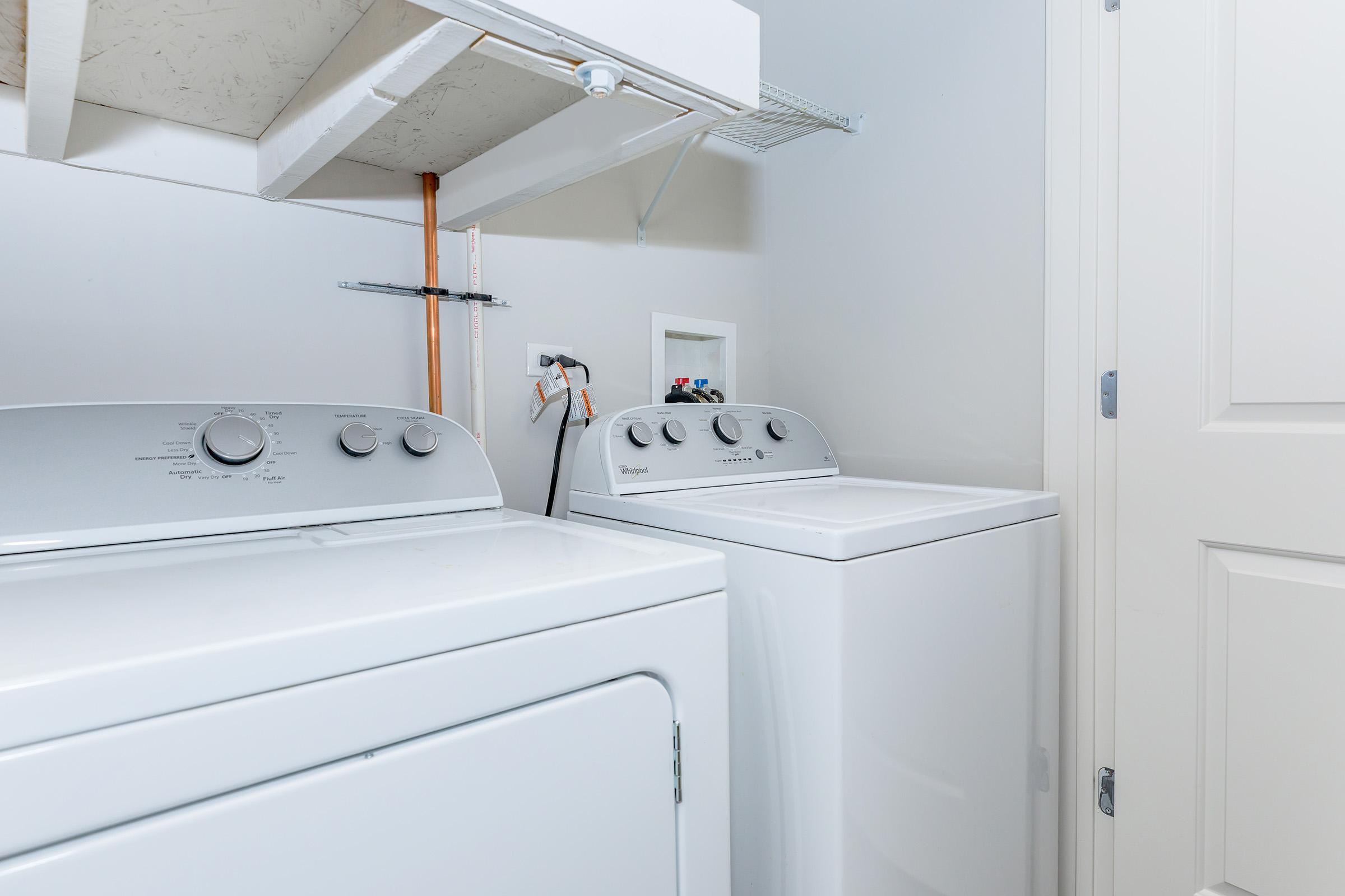 a kitchen with a stove and a refrigerator