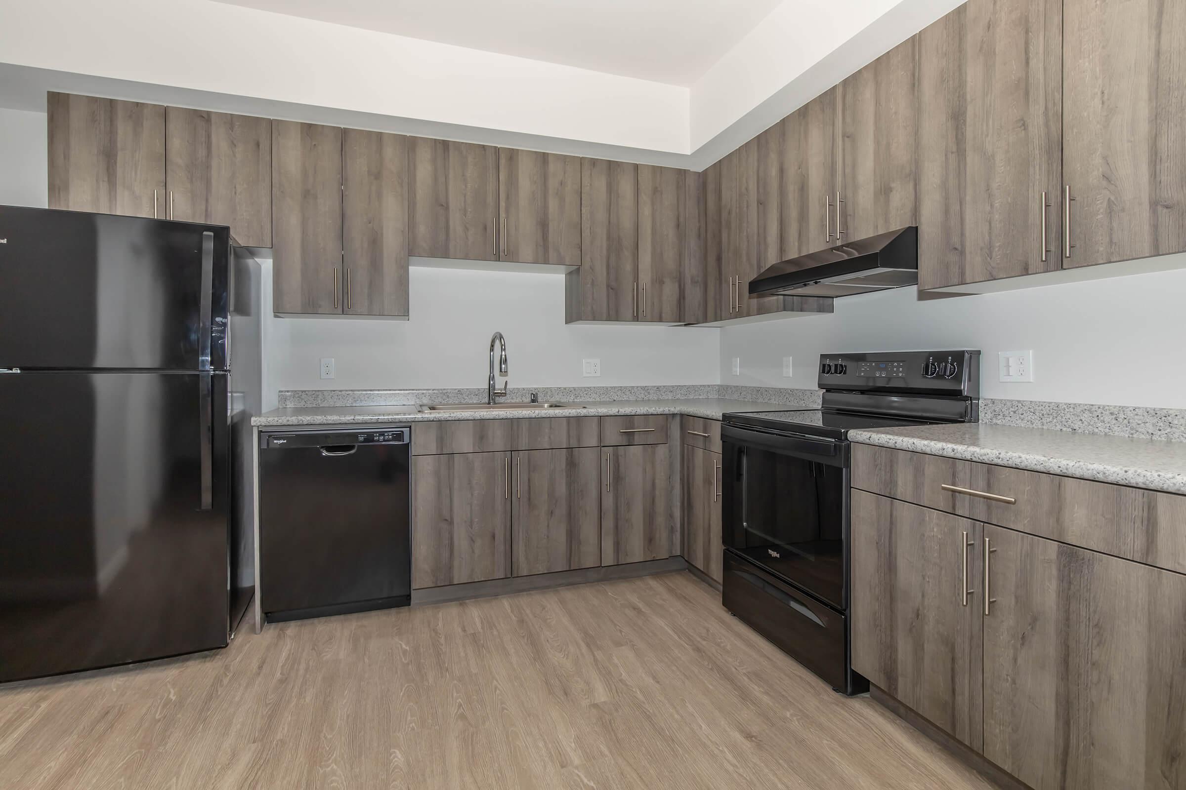 a kitchen with a wood floor