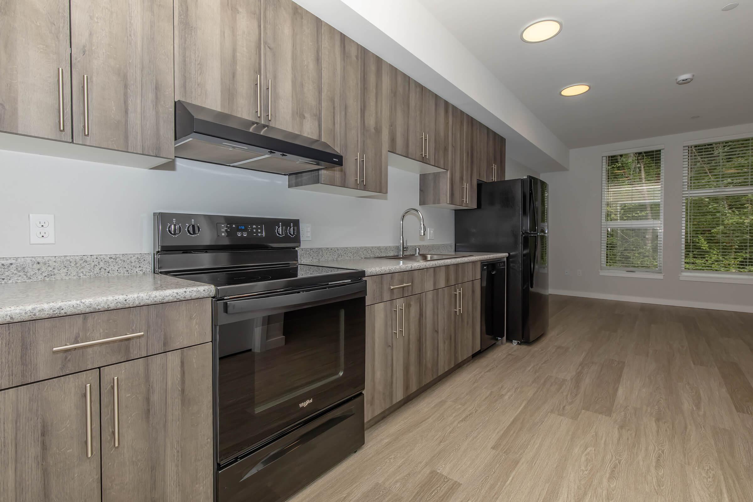 a kitchen with a wood floor