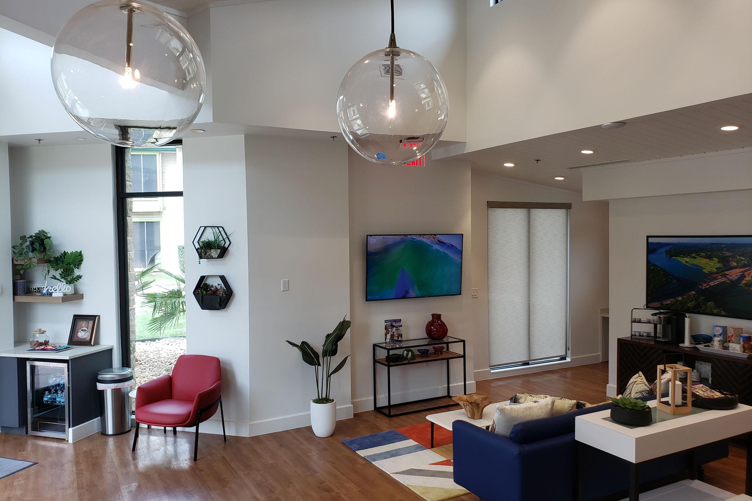a living room filled with furniture and a fire place