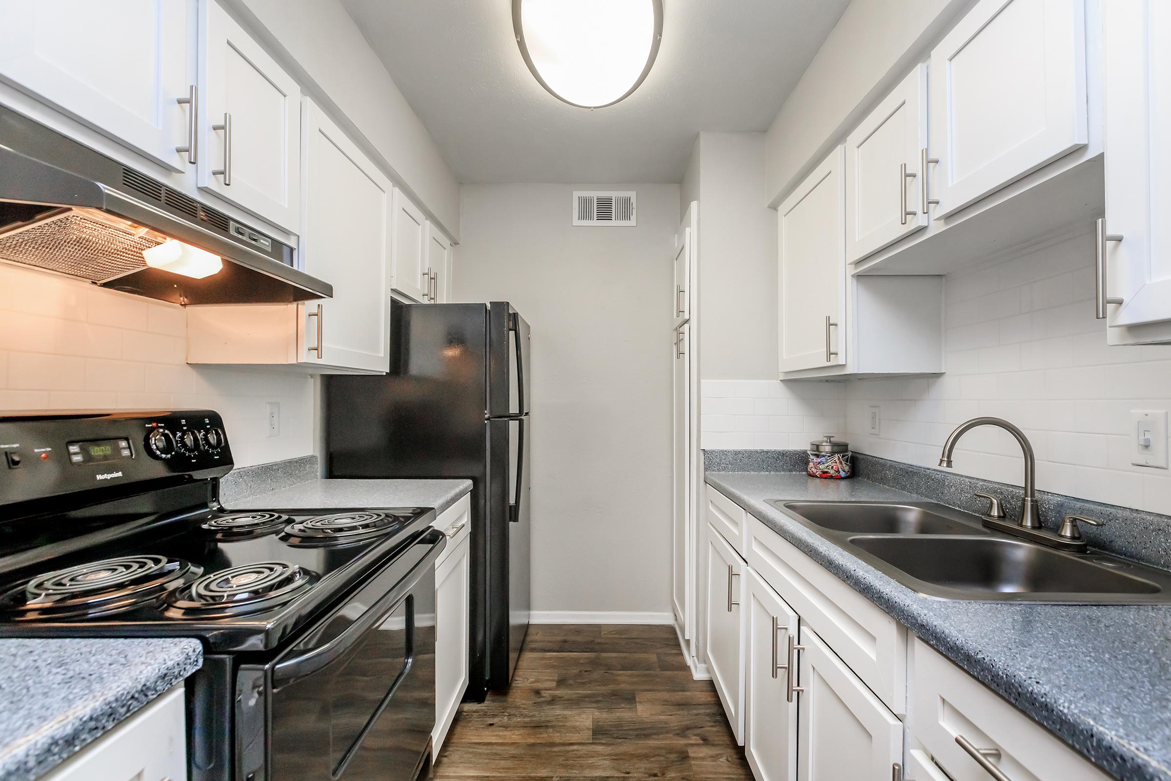 a modern kitchen with stainless steel appliances