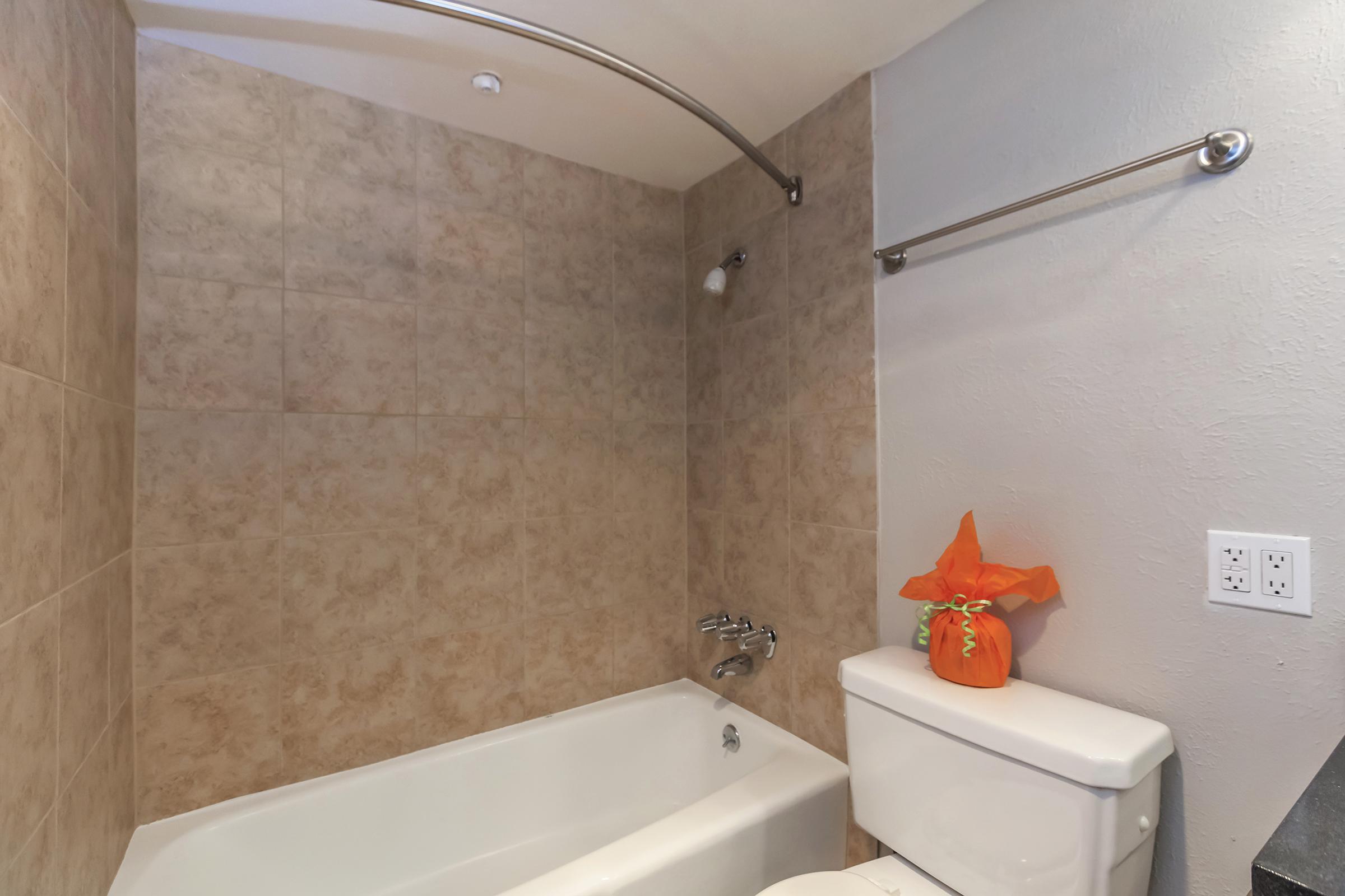 a white tub sitting next to a sink