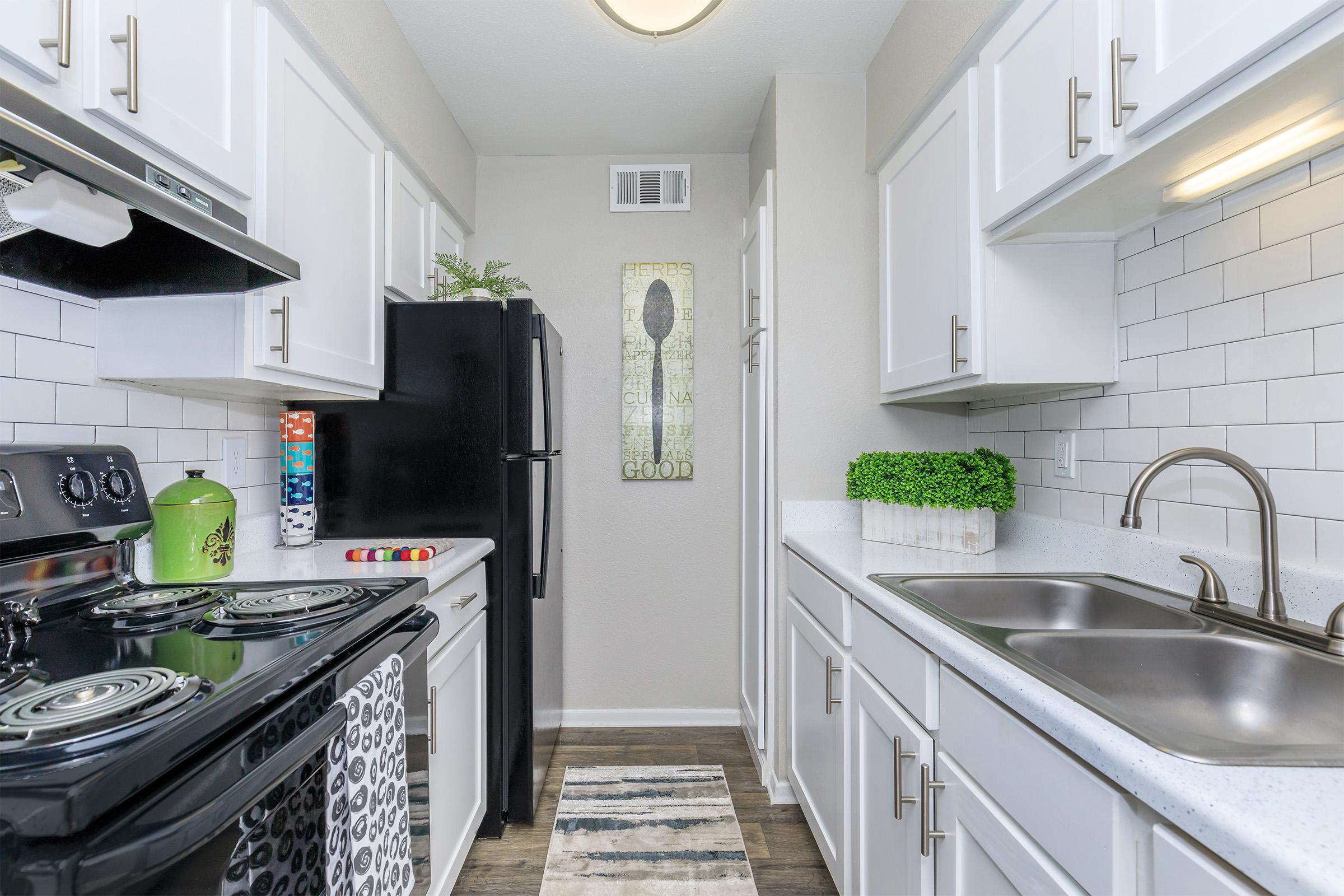 a large kitchen with stainless steel appliances