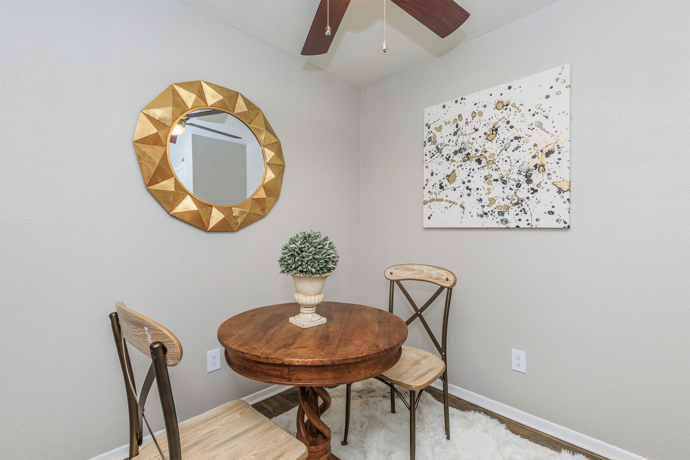 a room filled with furniture and vase on a table