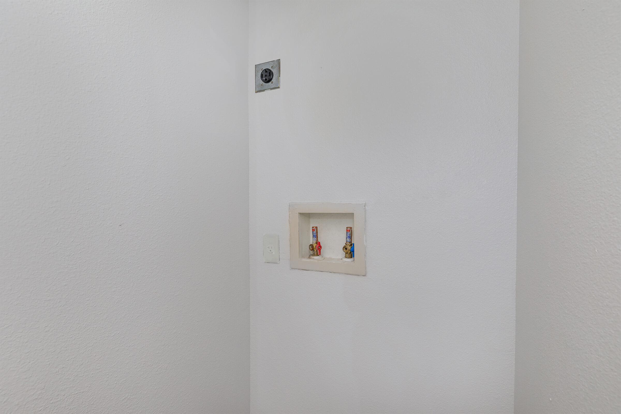 a white refrigerator freezer sitting in a room