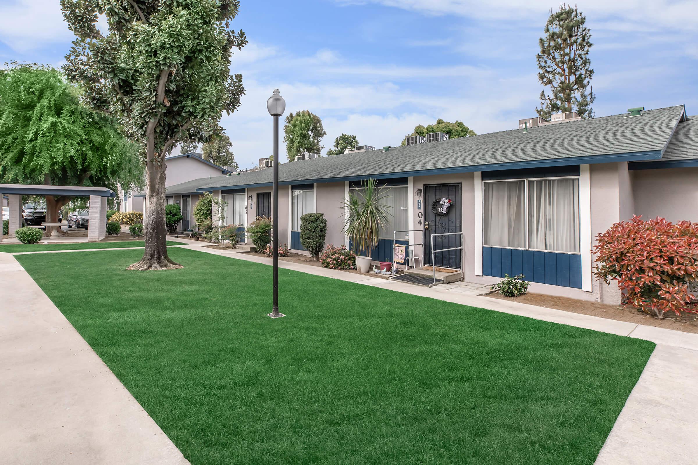 a large lawn in front of a house