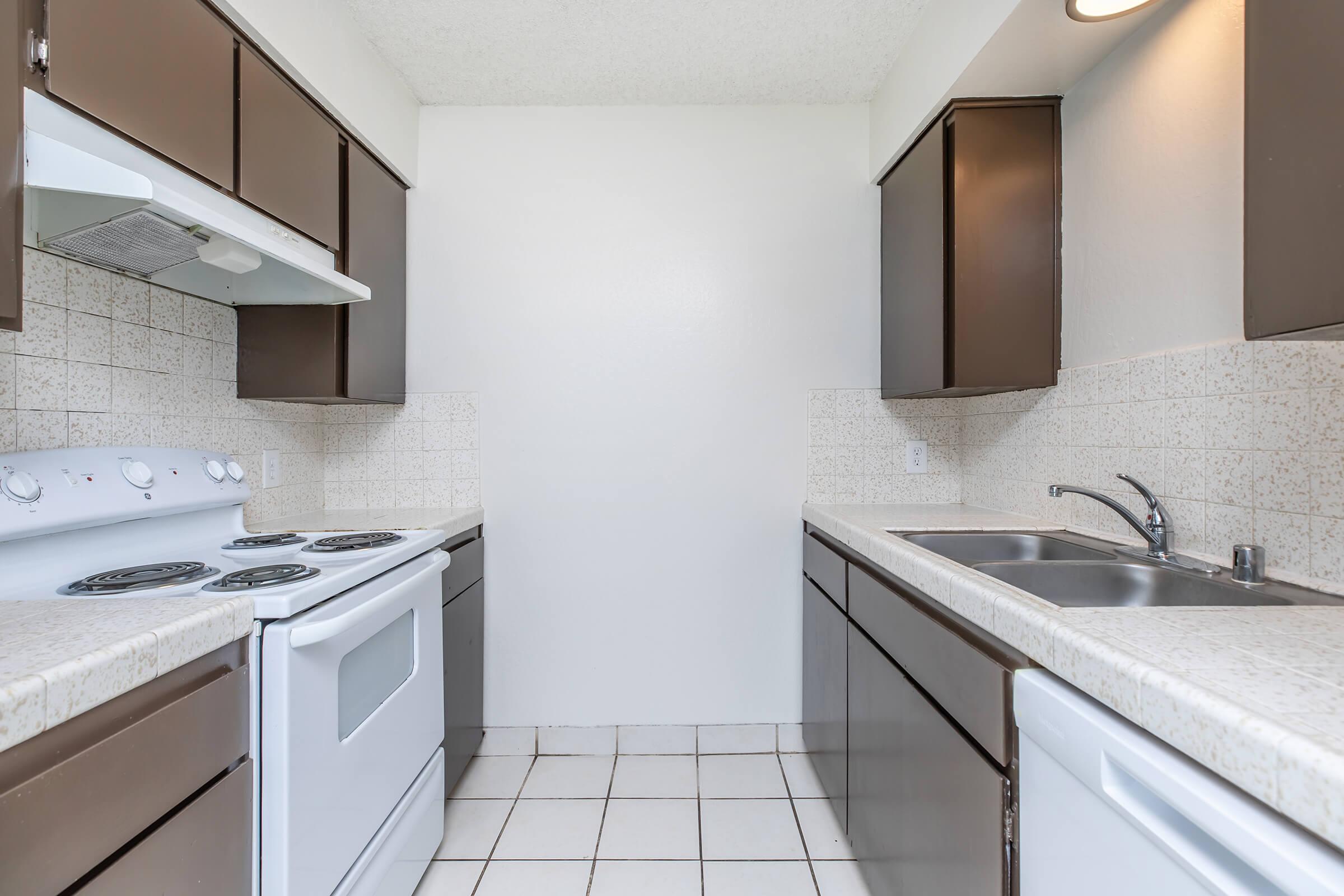 a kitchen with a stove and a sink