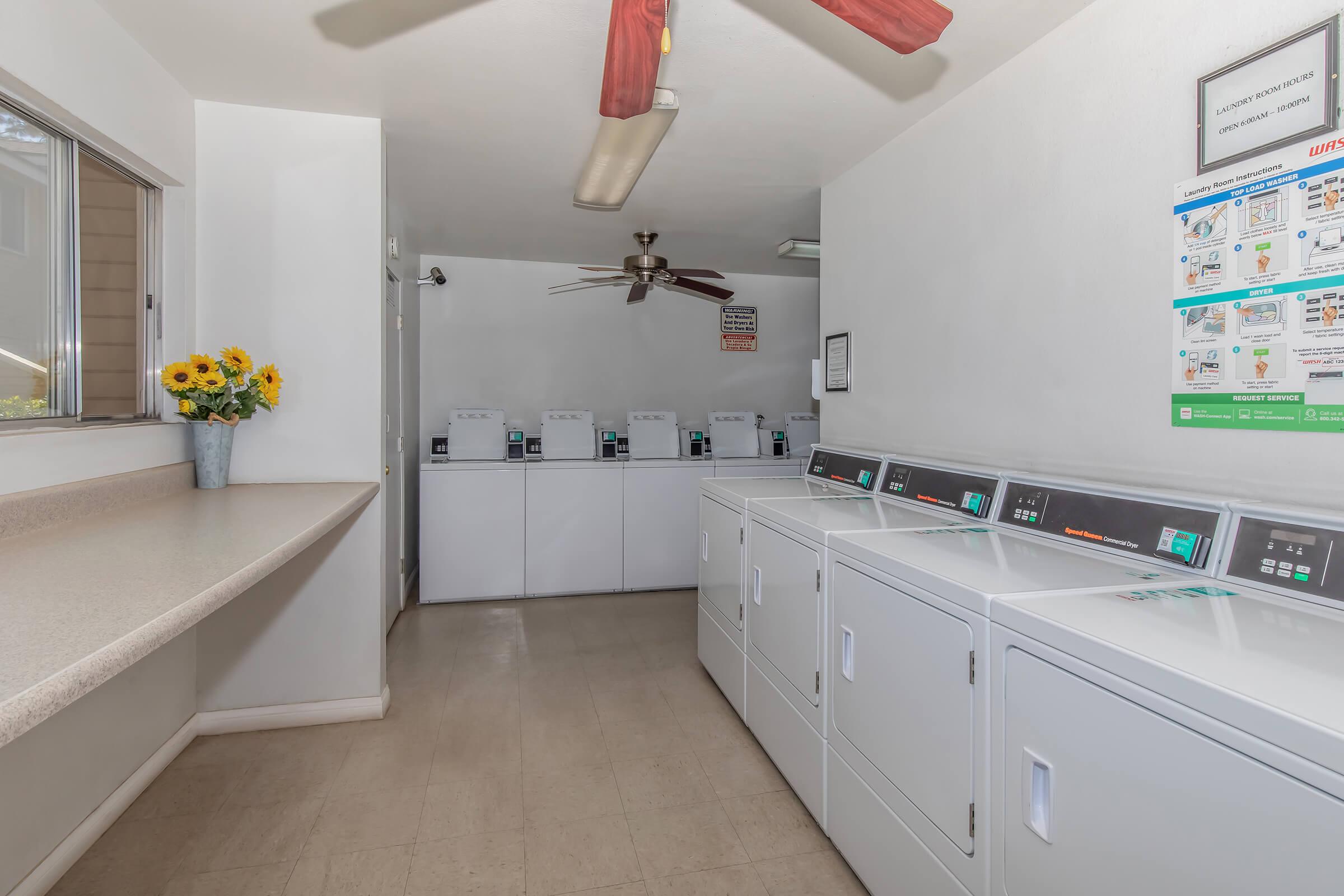 a kitchen with a sink and a mirror