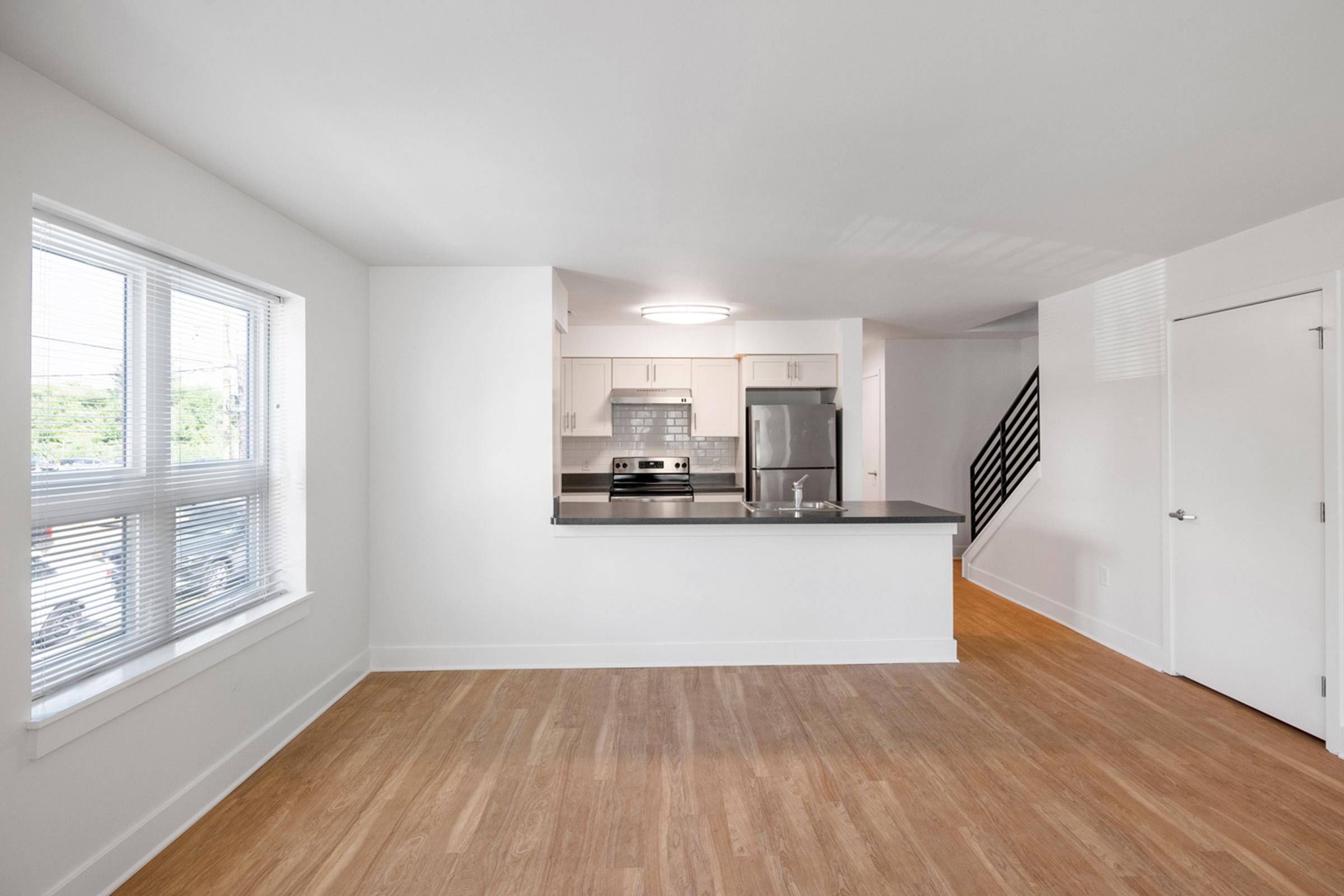 a room filled with furniture and a large window