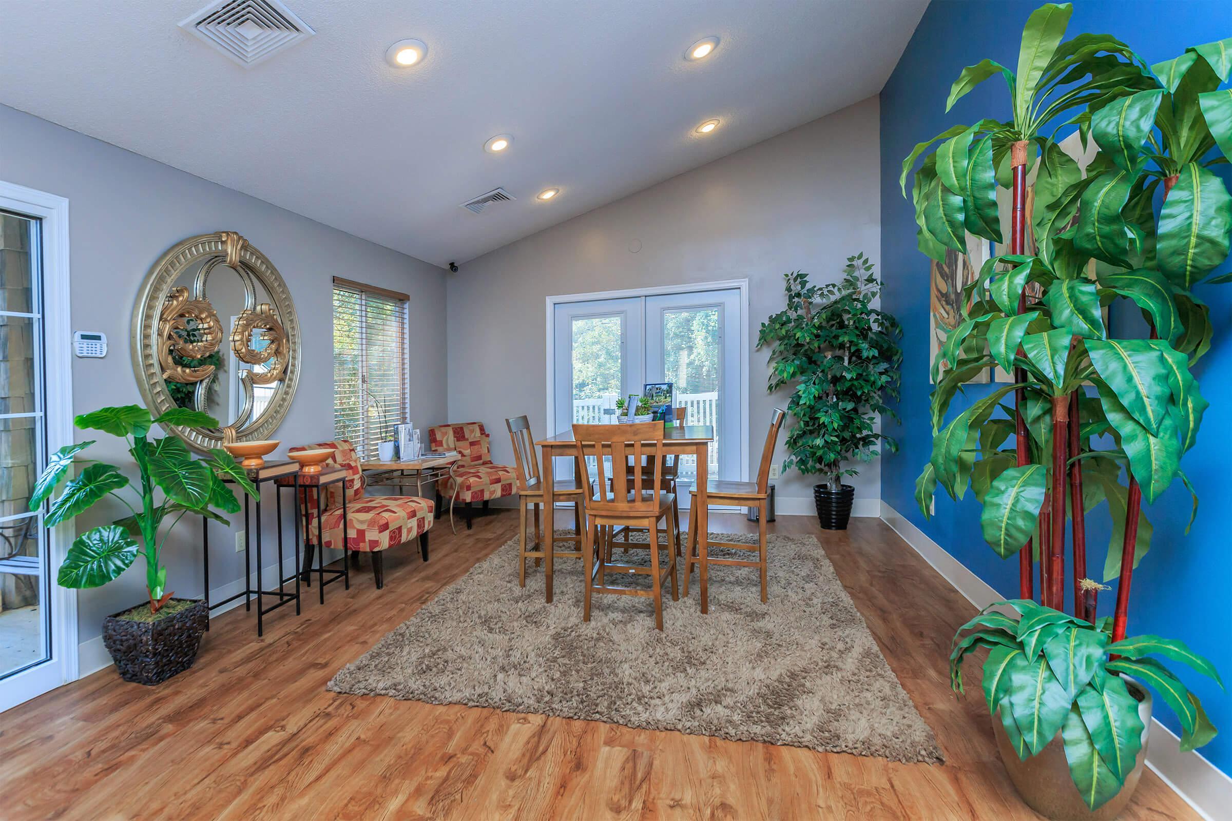 a living room filled with furniture and a large window