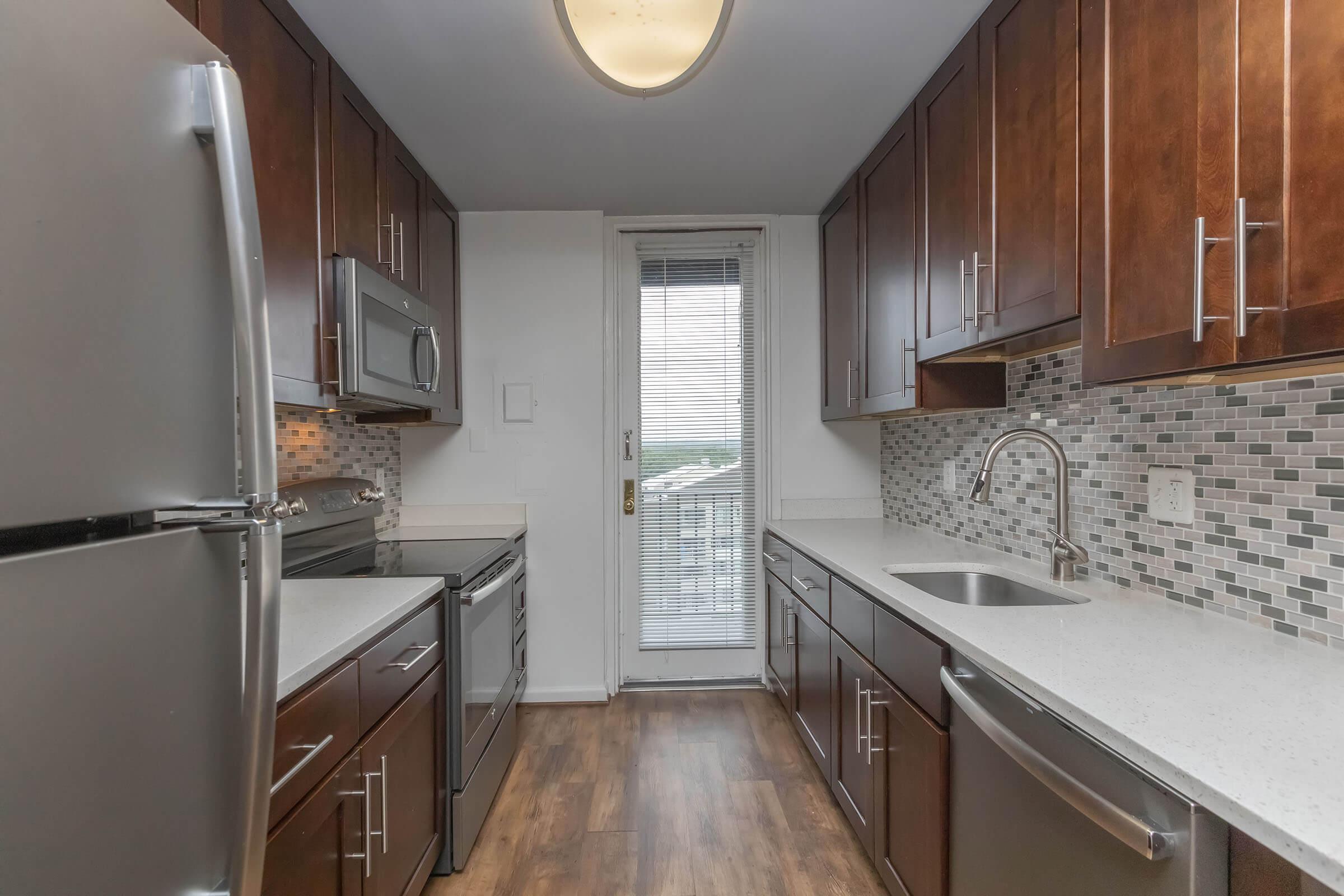 a stainless steel refrigerator in a kitchen