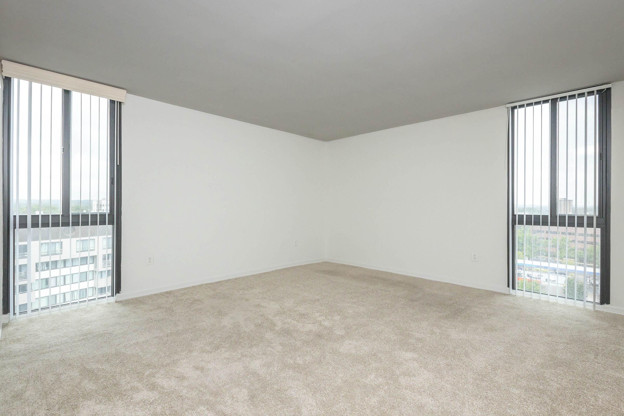 a bedroom with a large window