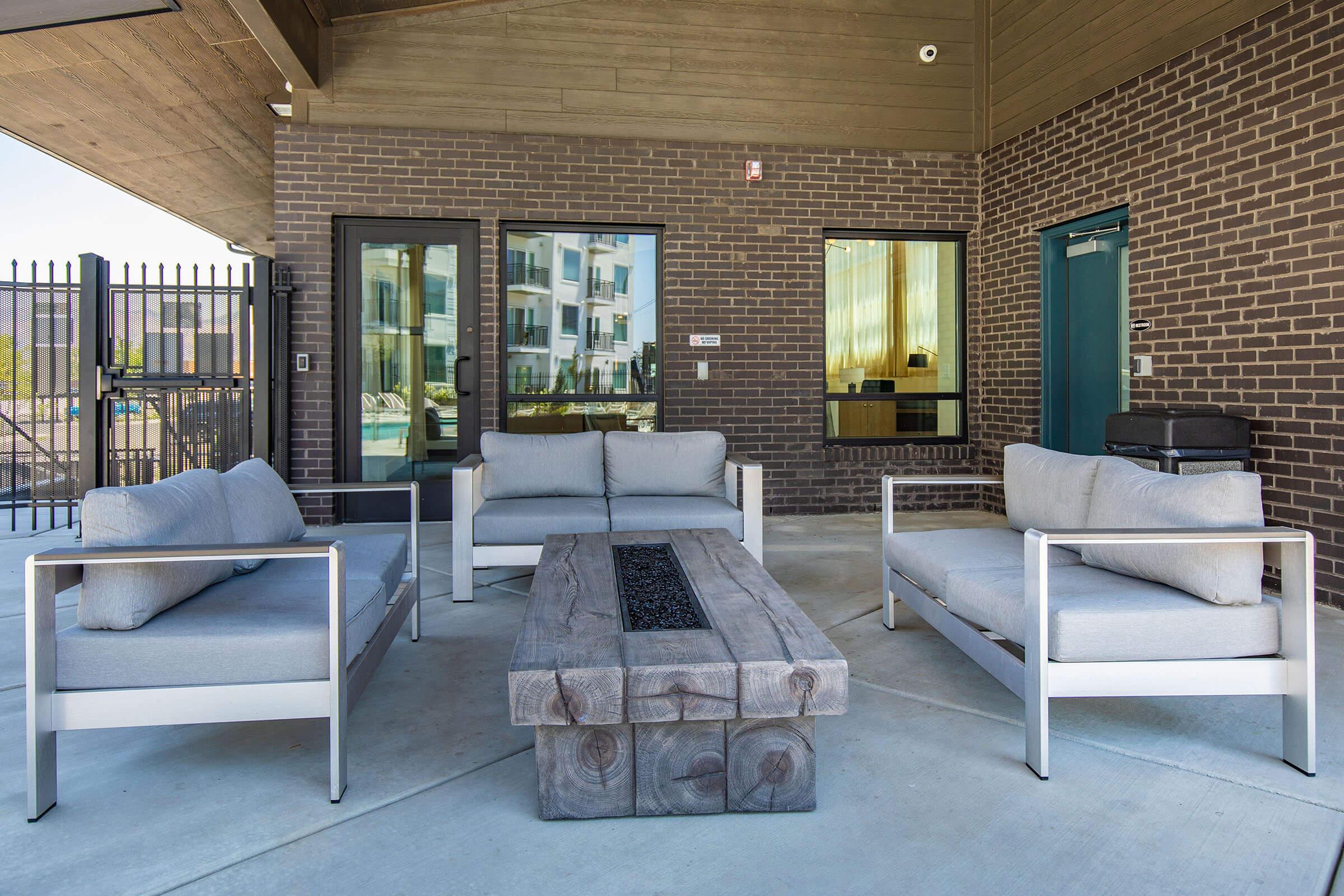 a living room filled with furniture and a bench