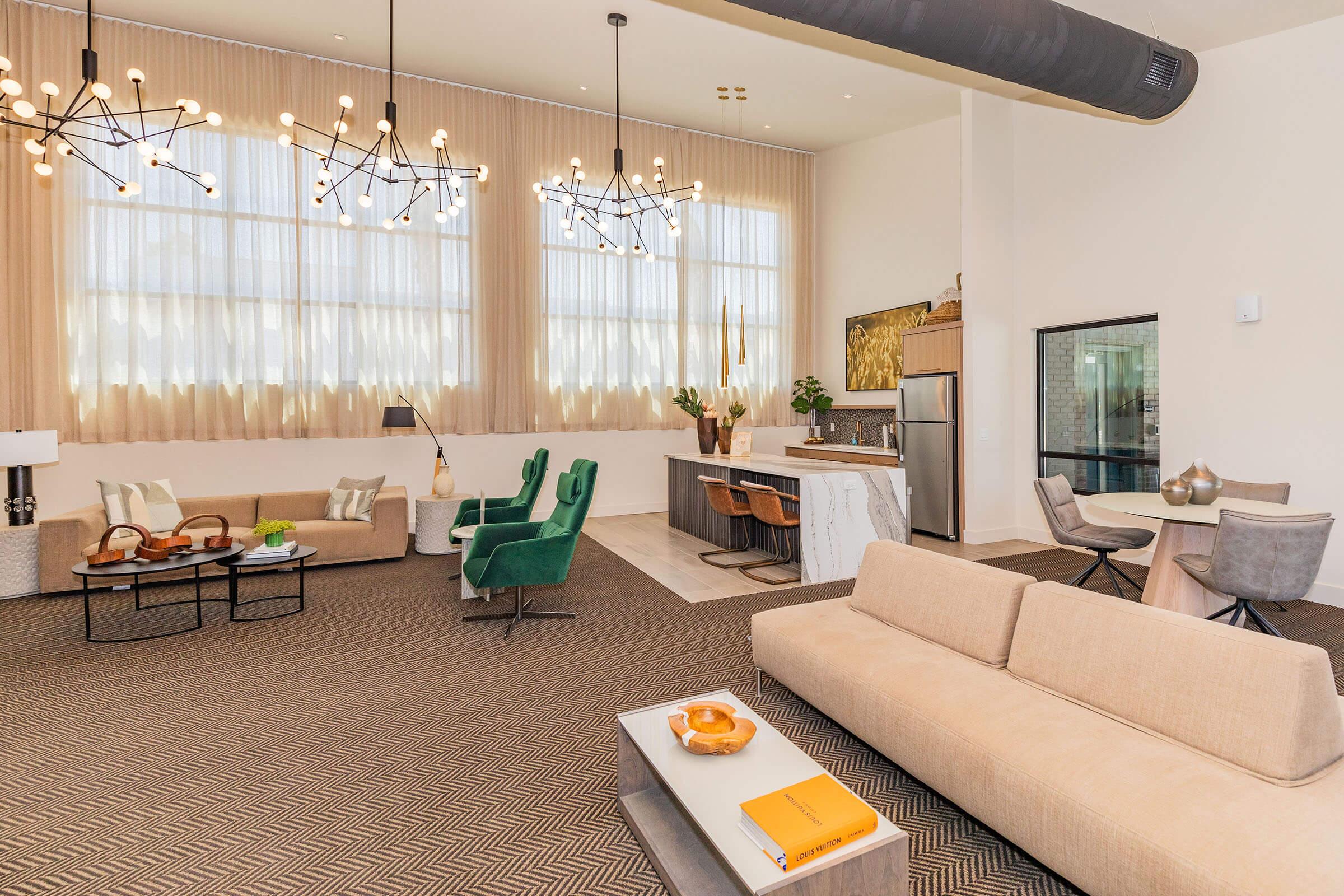 a living room filled with furniture and a large window