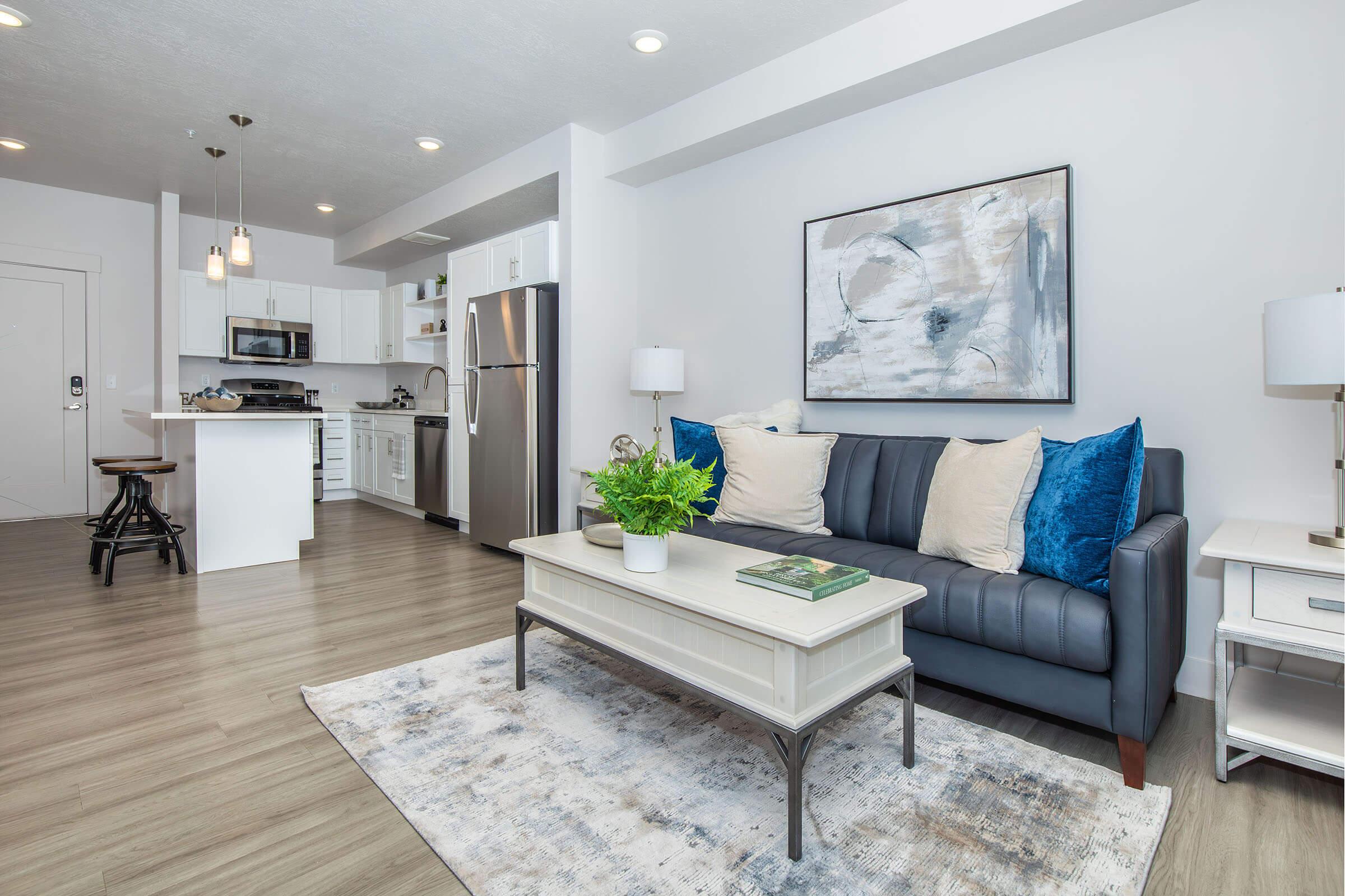 a living room filled with furniture and a fireplace