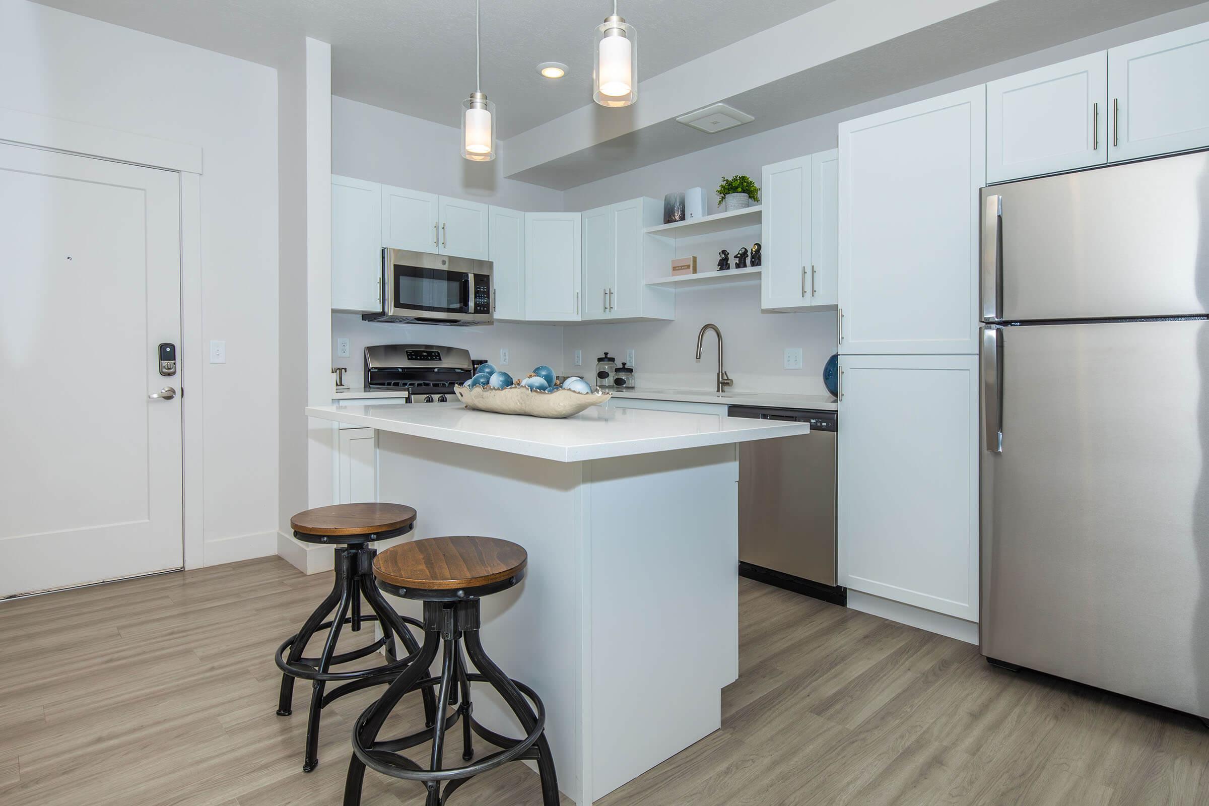 a kitchen with a sink and a refrigerator