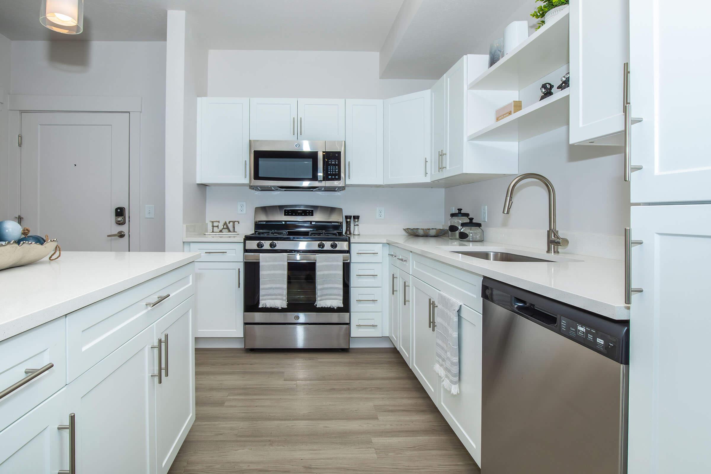 a kitchen with a stove and a sink