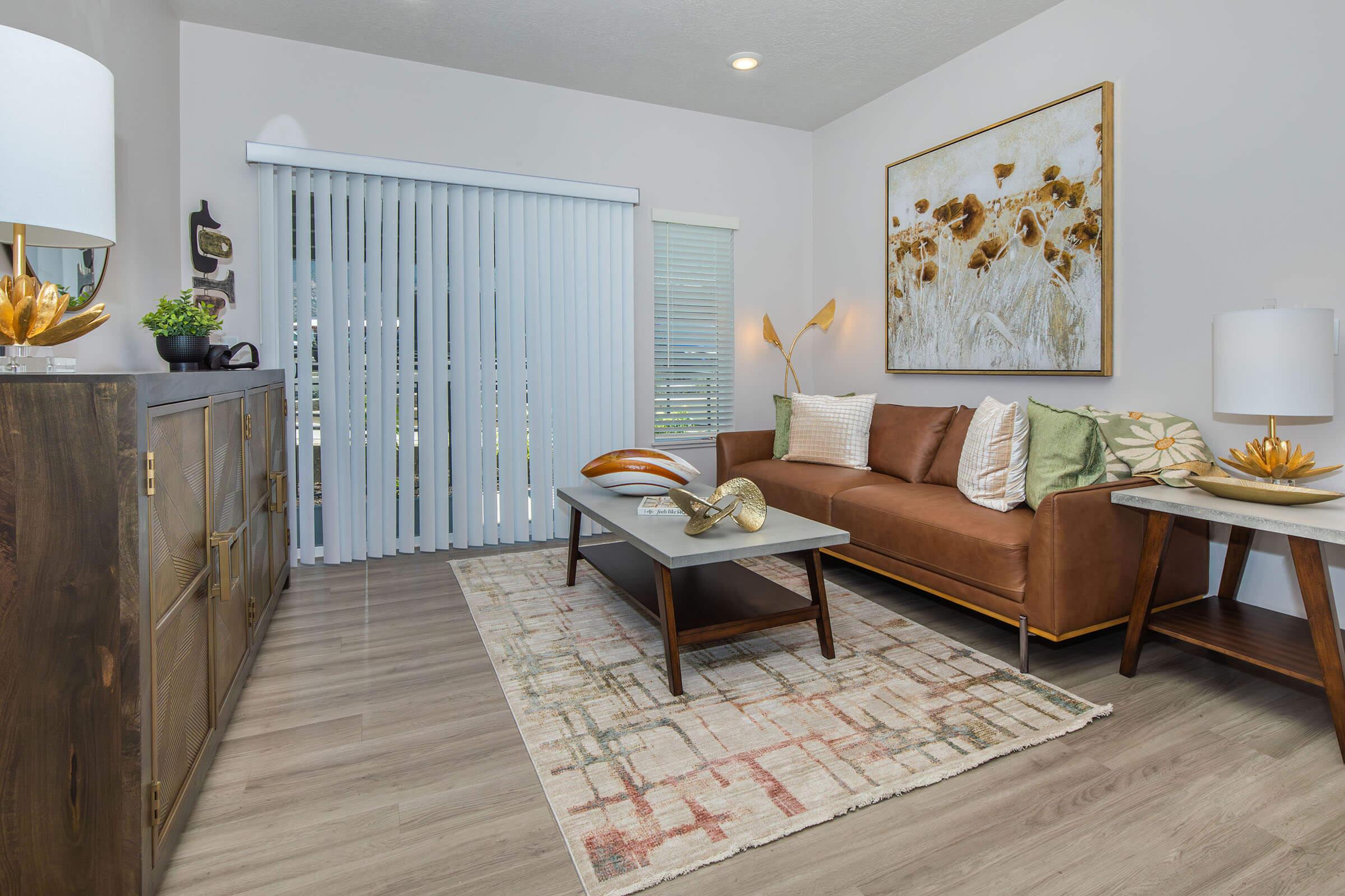 a living room filled with furniture and a table