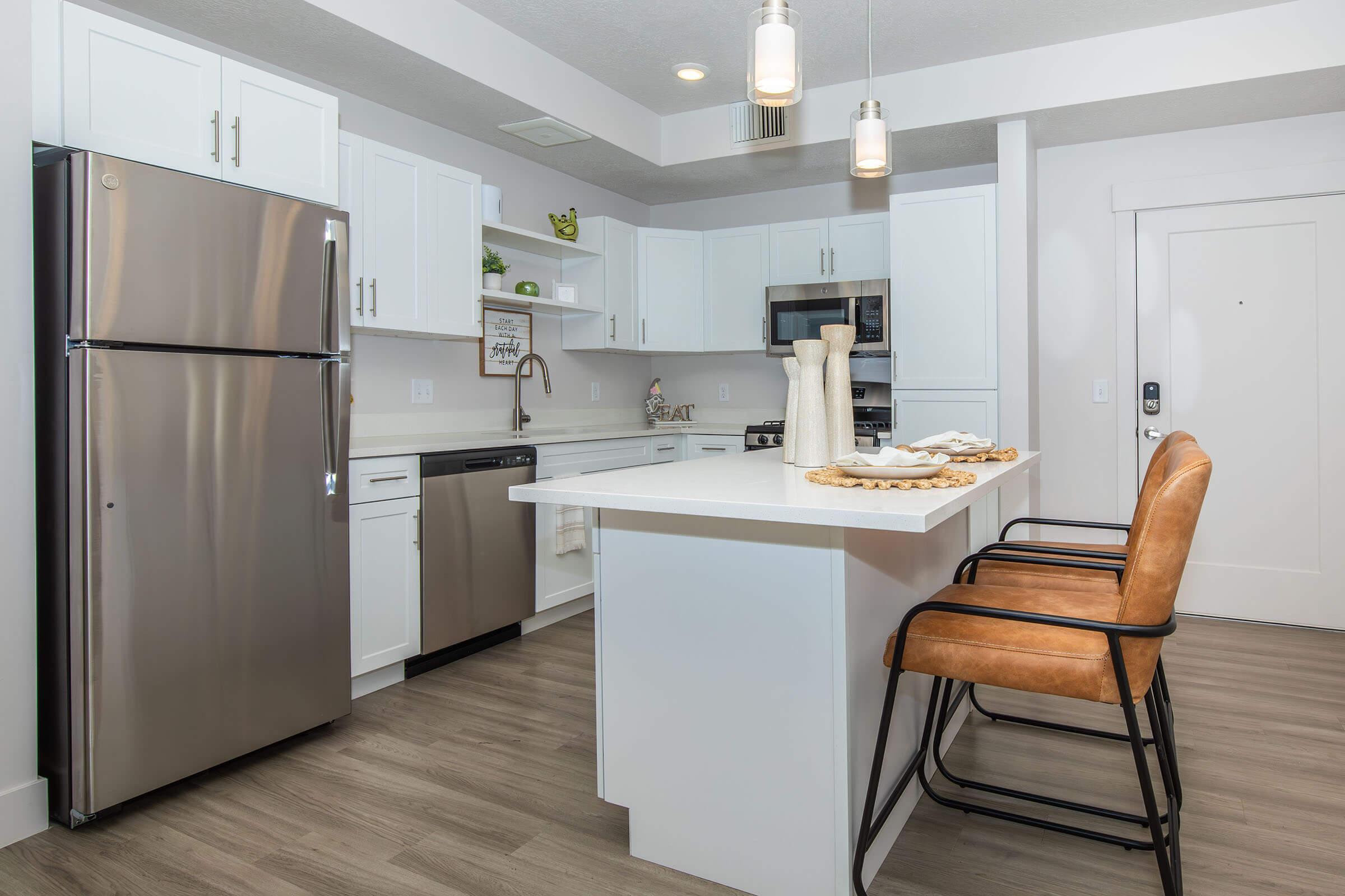 a kitchen with a stove and a refrigerator