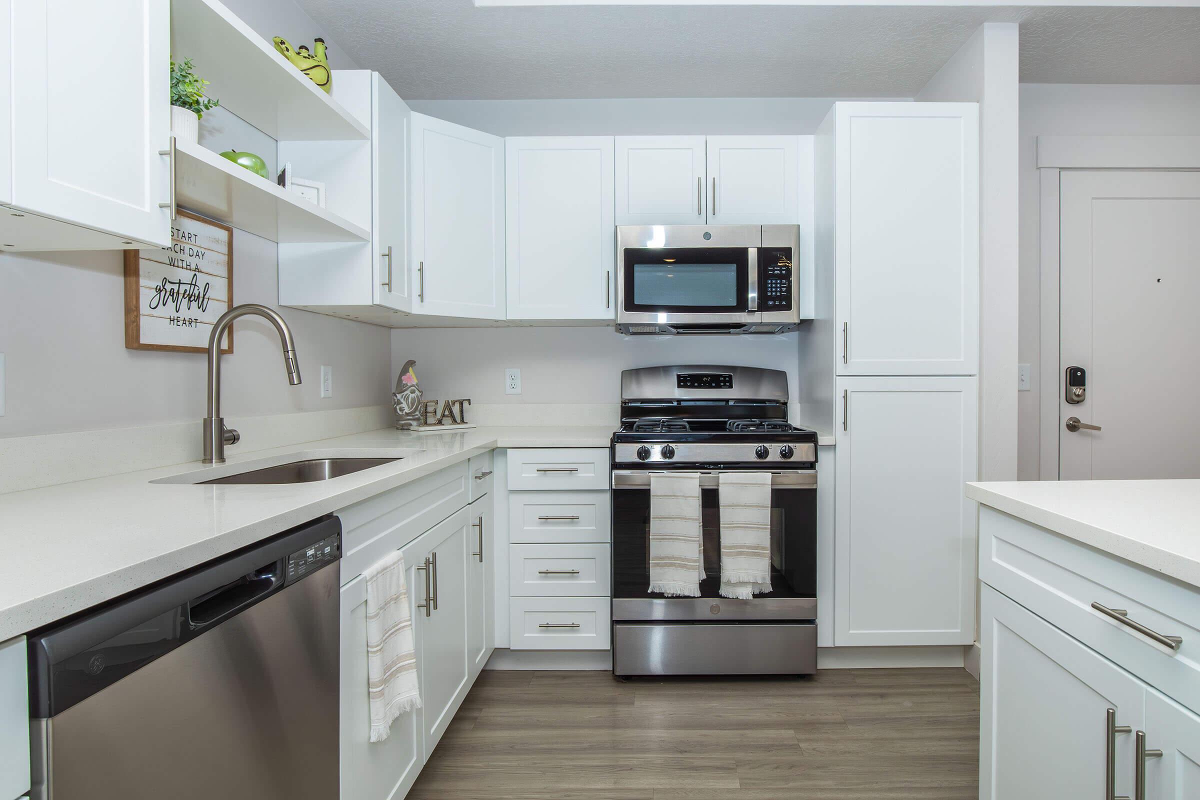 a kitchen with a sink and a microwave