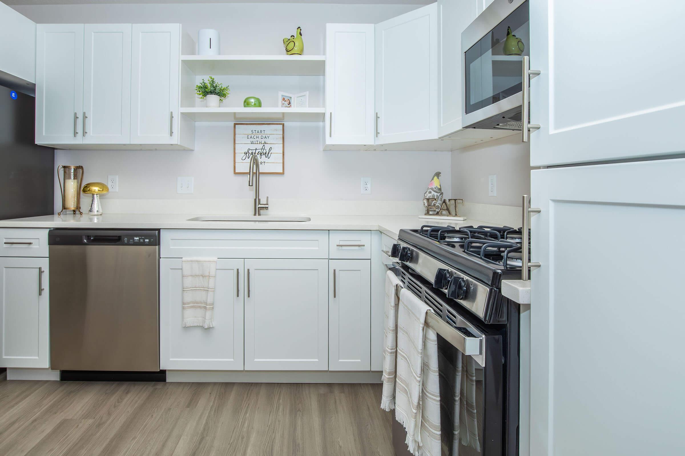 a kitchen with a stove top oven sitting inside of a refrigerator