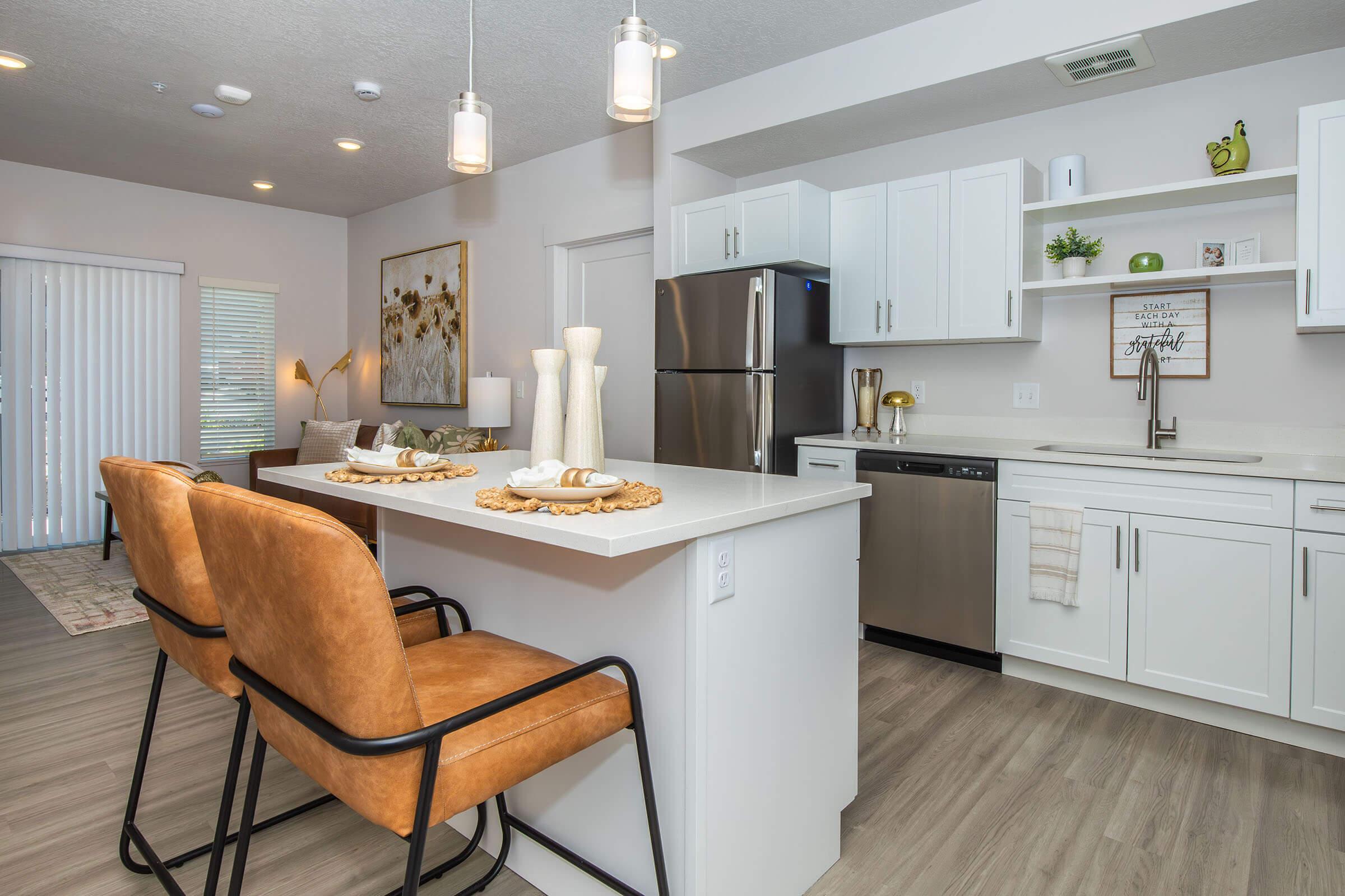 a kitchen with an island in the middle of a room