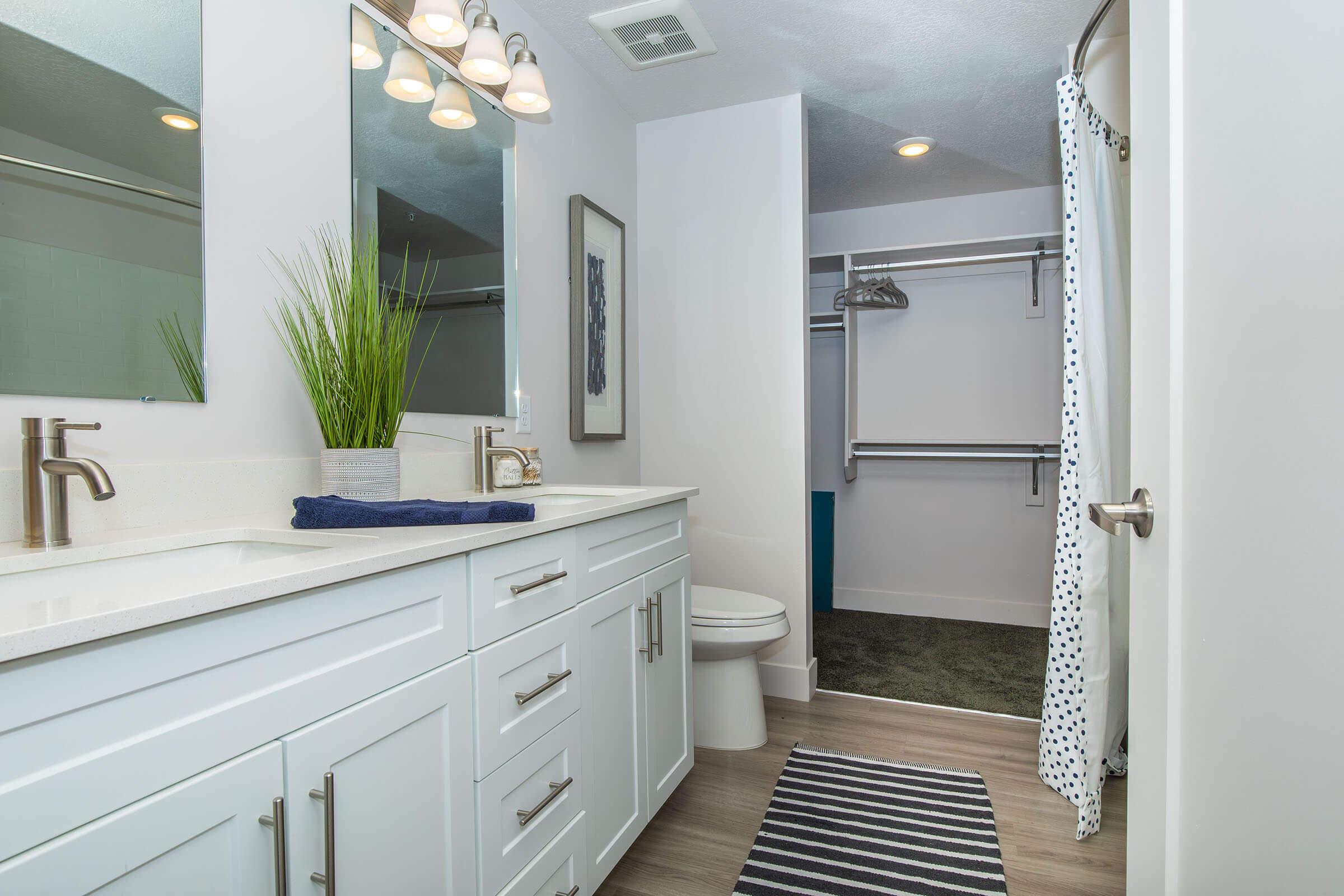 a kitchen with a sink and a mirror