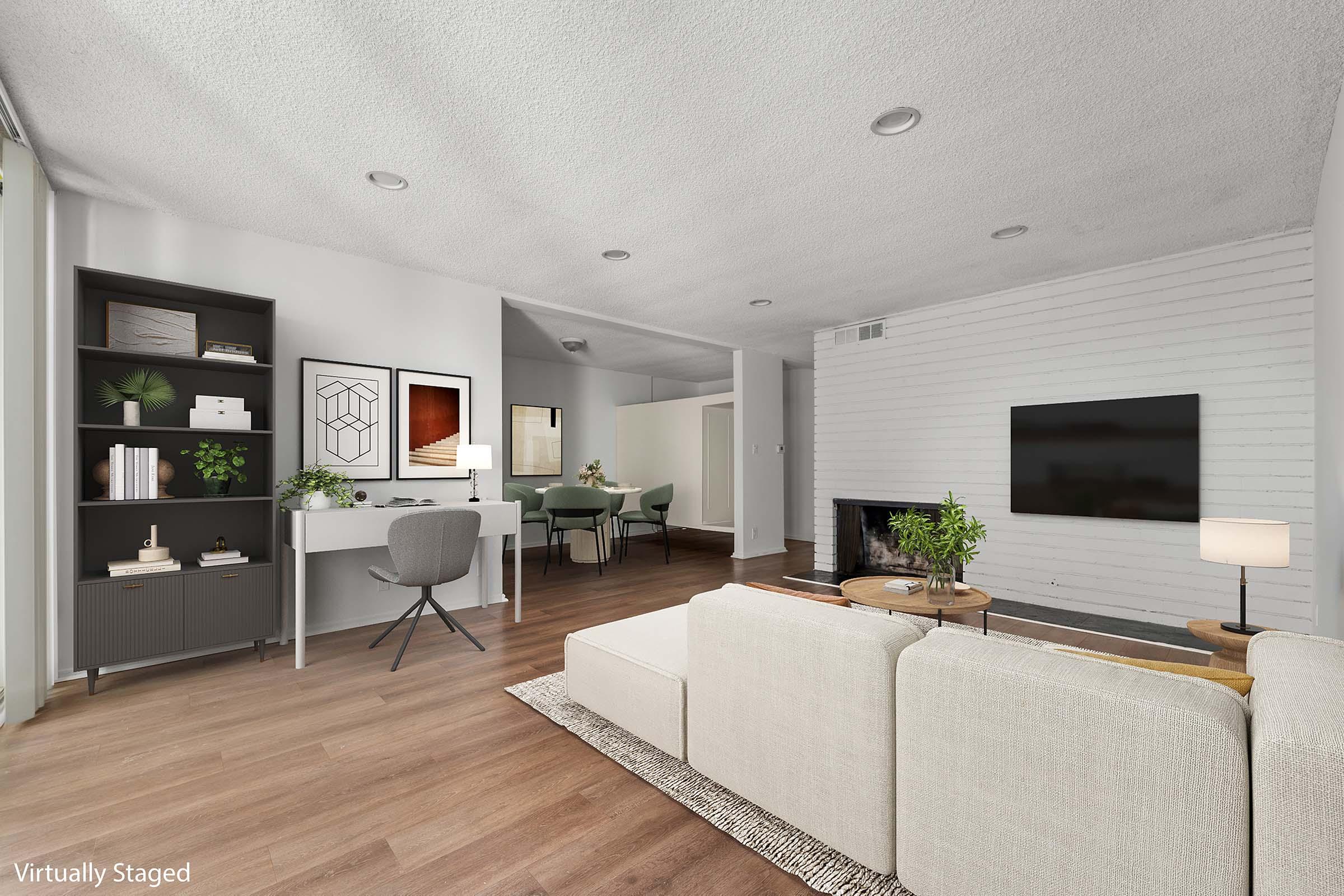 a living room filled with furniture and a fireplace