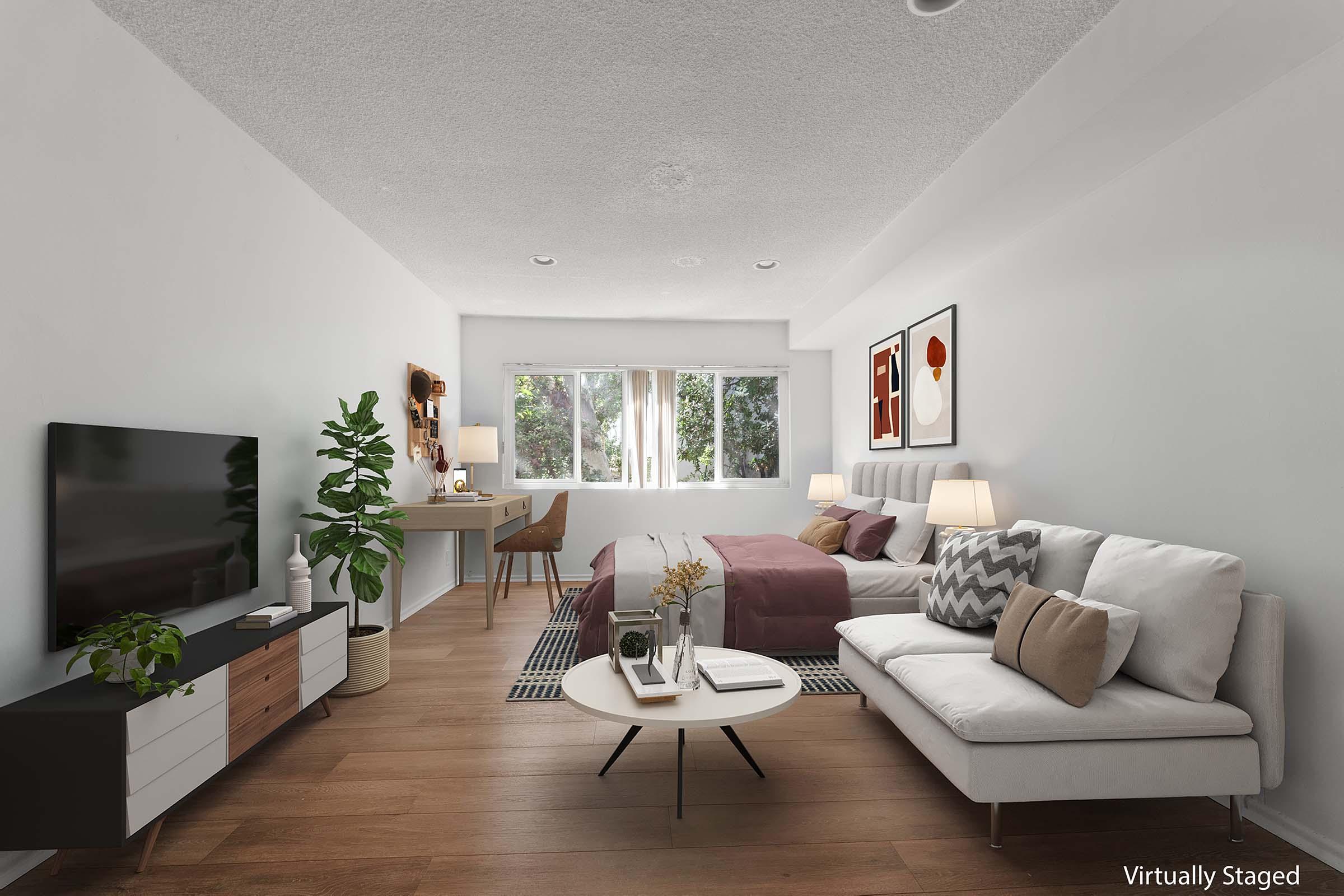 a living room filled with furniture and a flat screen tv