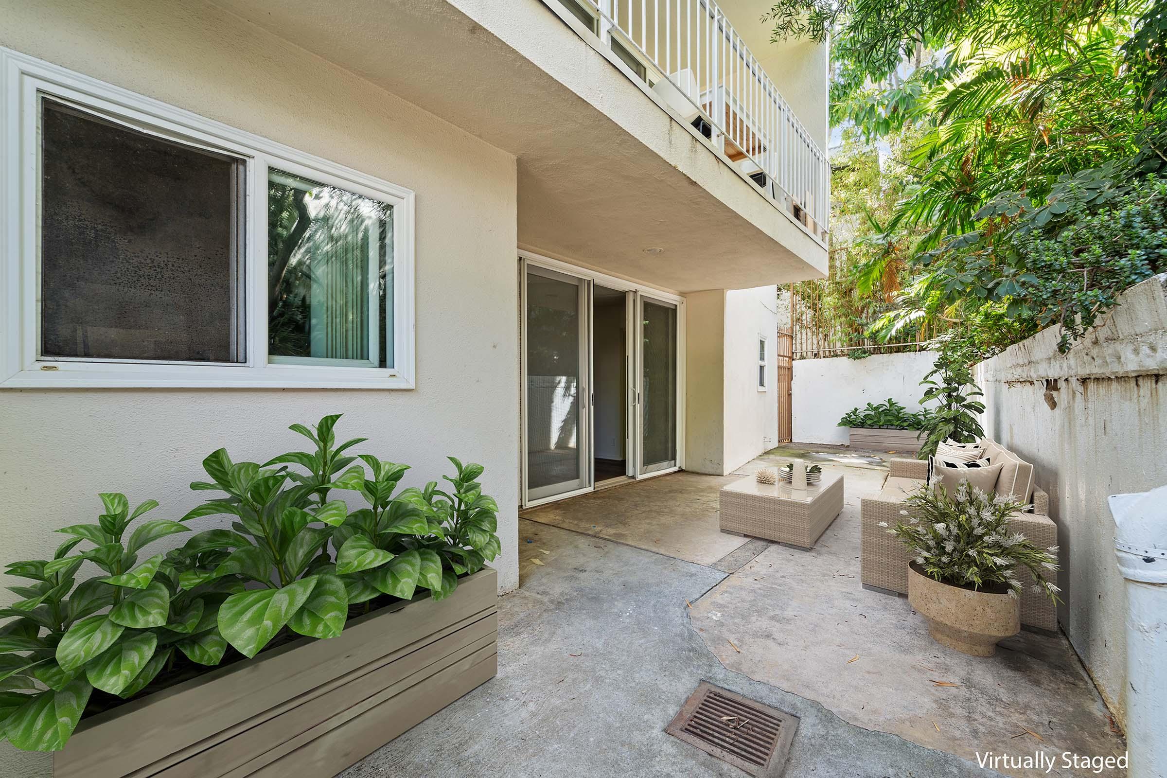 a room filled with furniture and a plant in a garden