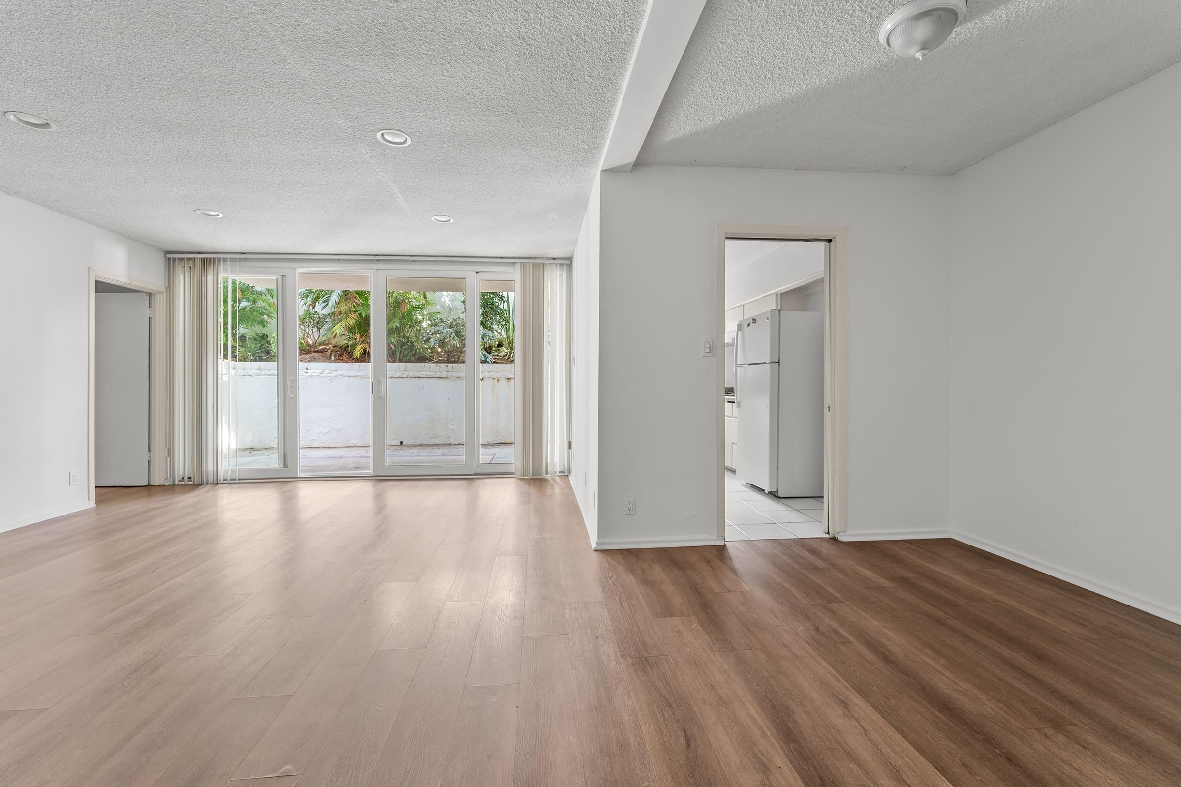 a large empty room with a wood floor