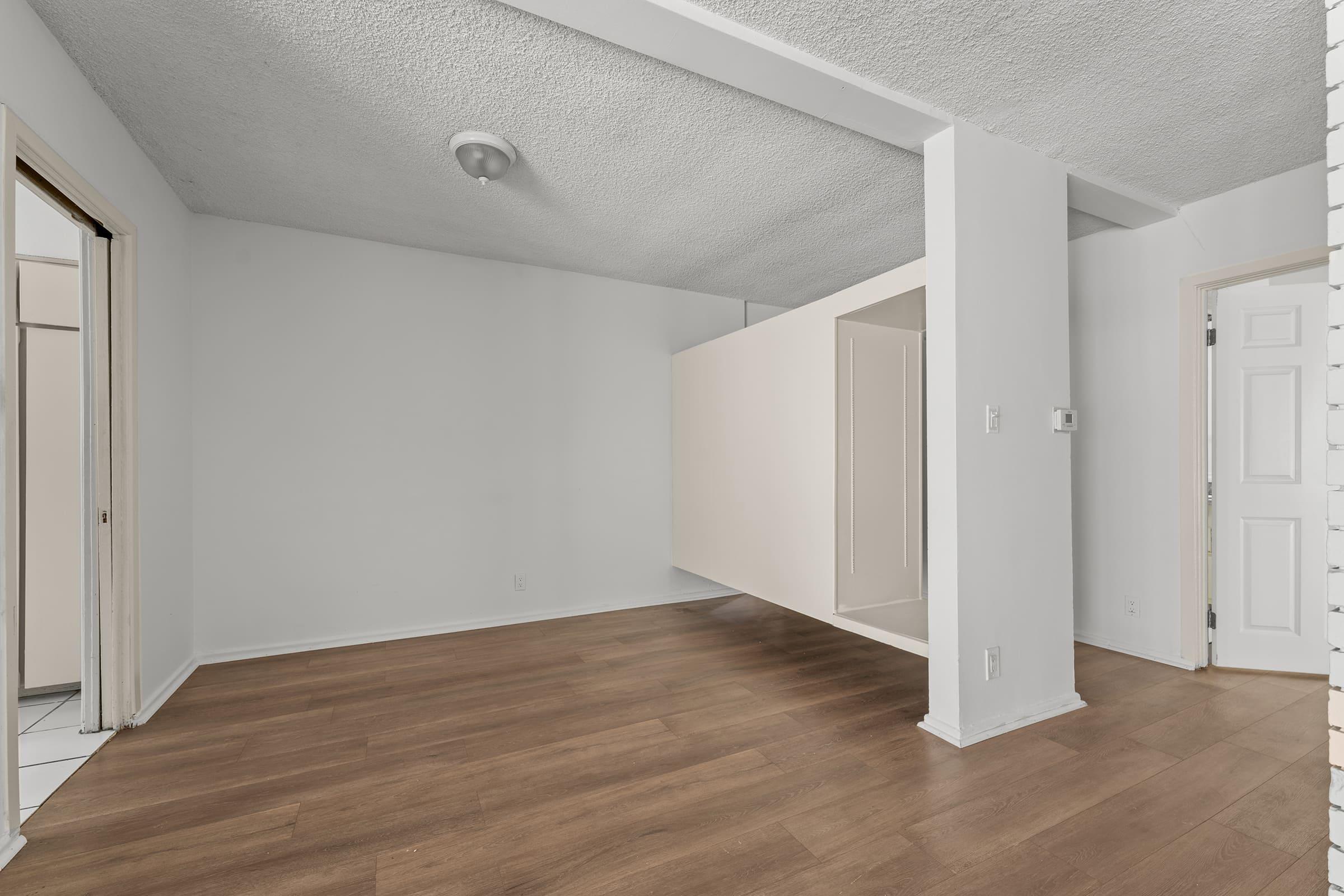 a kitchen with a wood floor