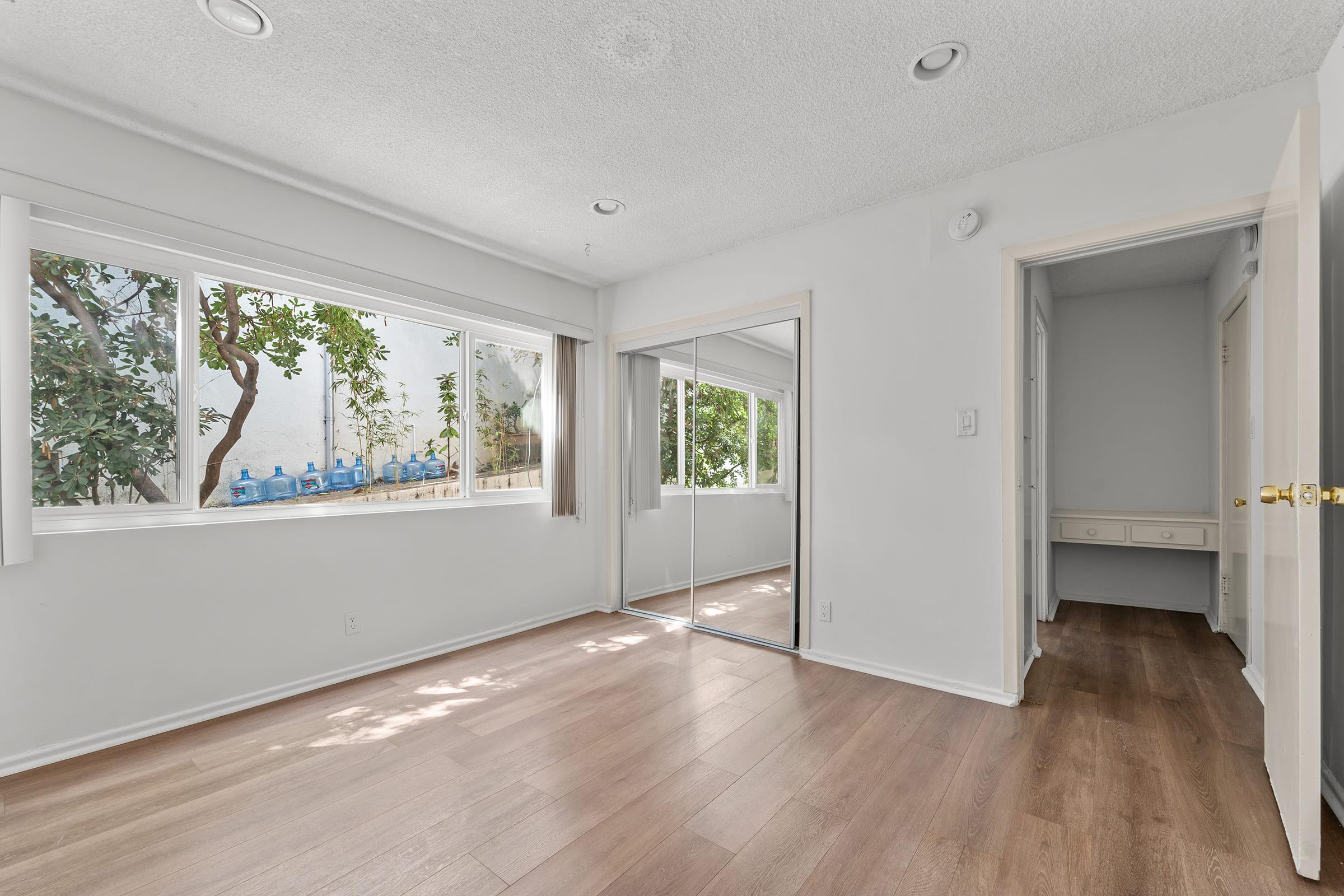 a room filled with furniture and a large window