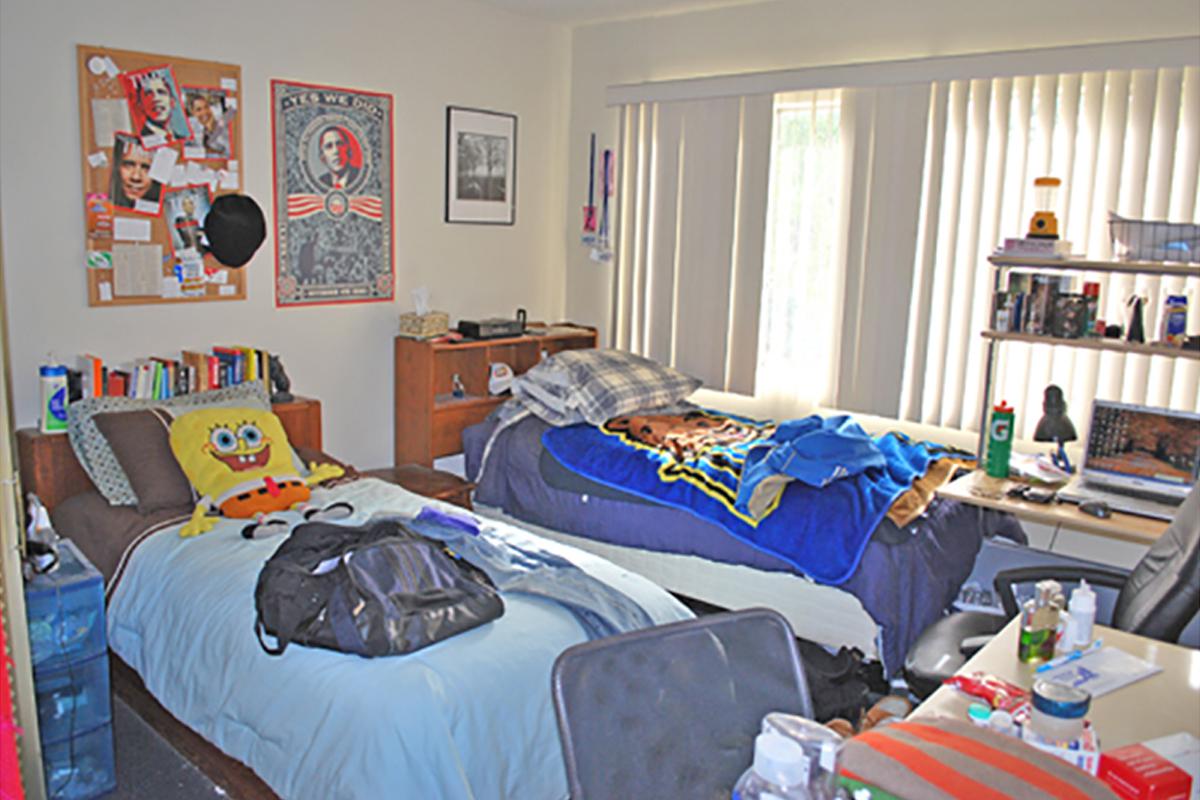 a room with many items on the bed