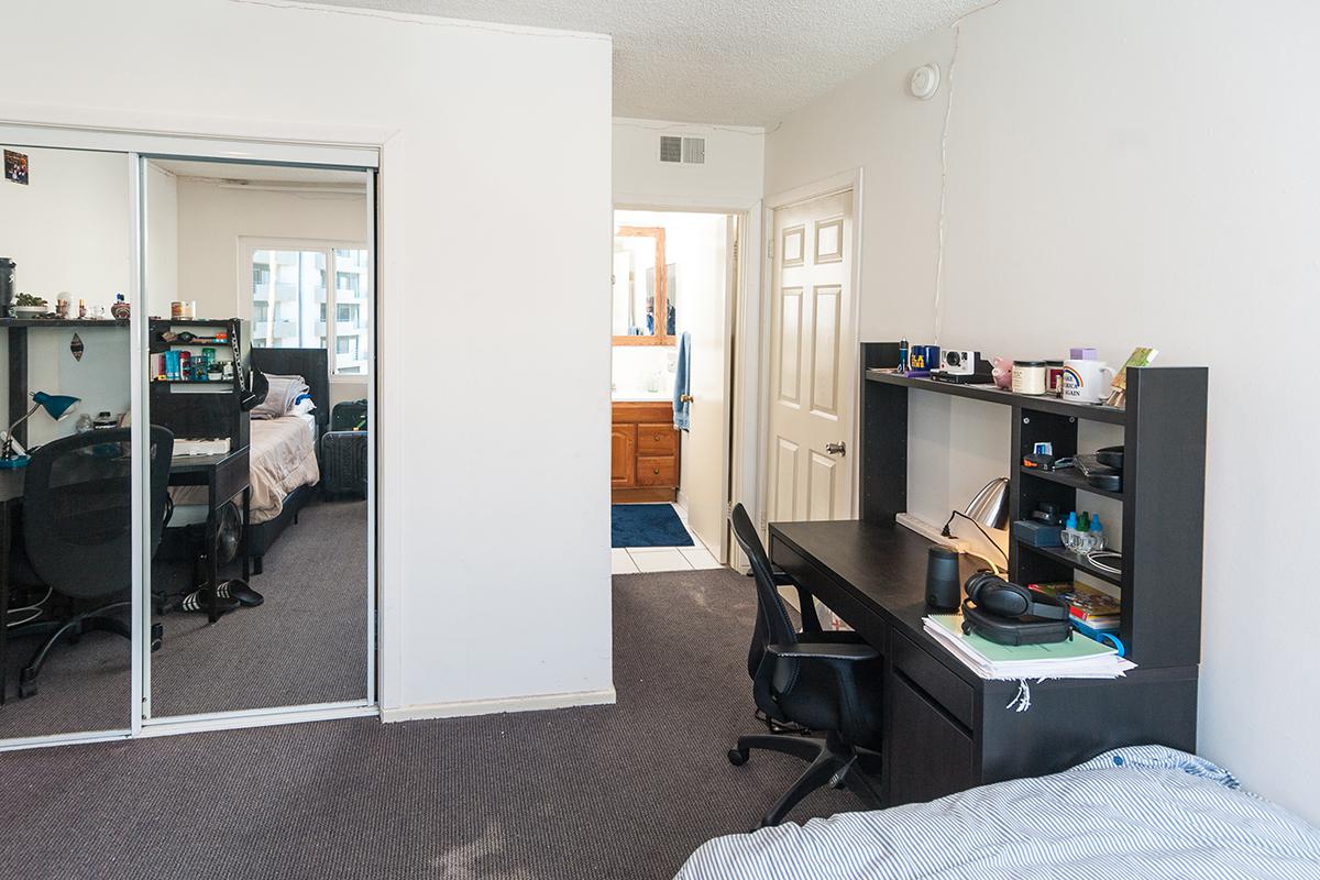 a living room filled with furniture and a tv